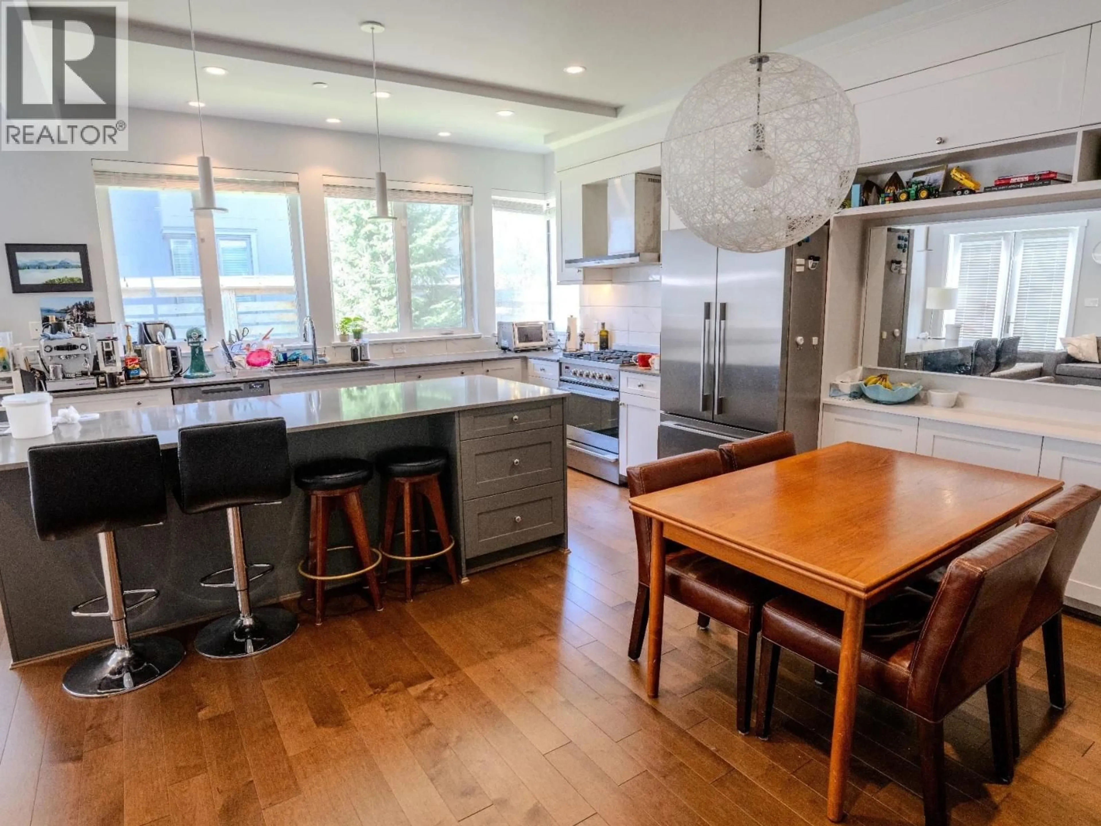 Open concept kitchen, wood/laminate floor for 7433 ARMSTRONG STREET, Richmond British Columbia V6Y0K4