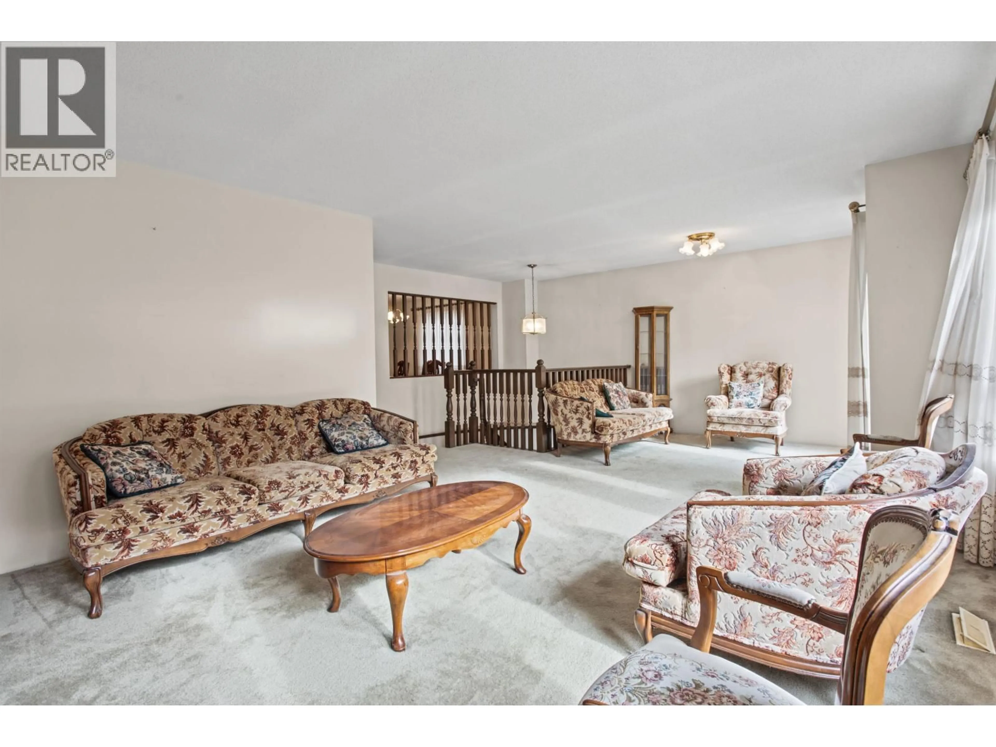 Living room with furniture, carpet floor for 4407 13TH AVENUE, Vancouver British Columbia V6R2V2