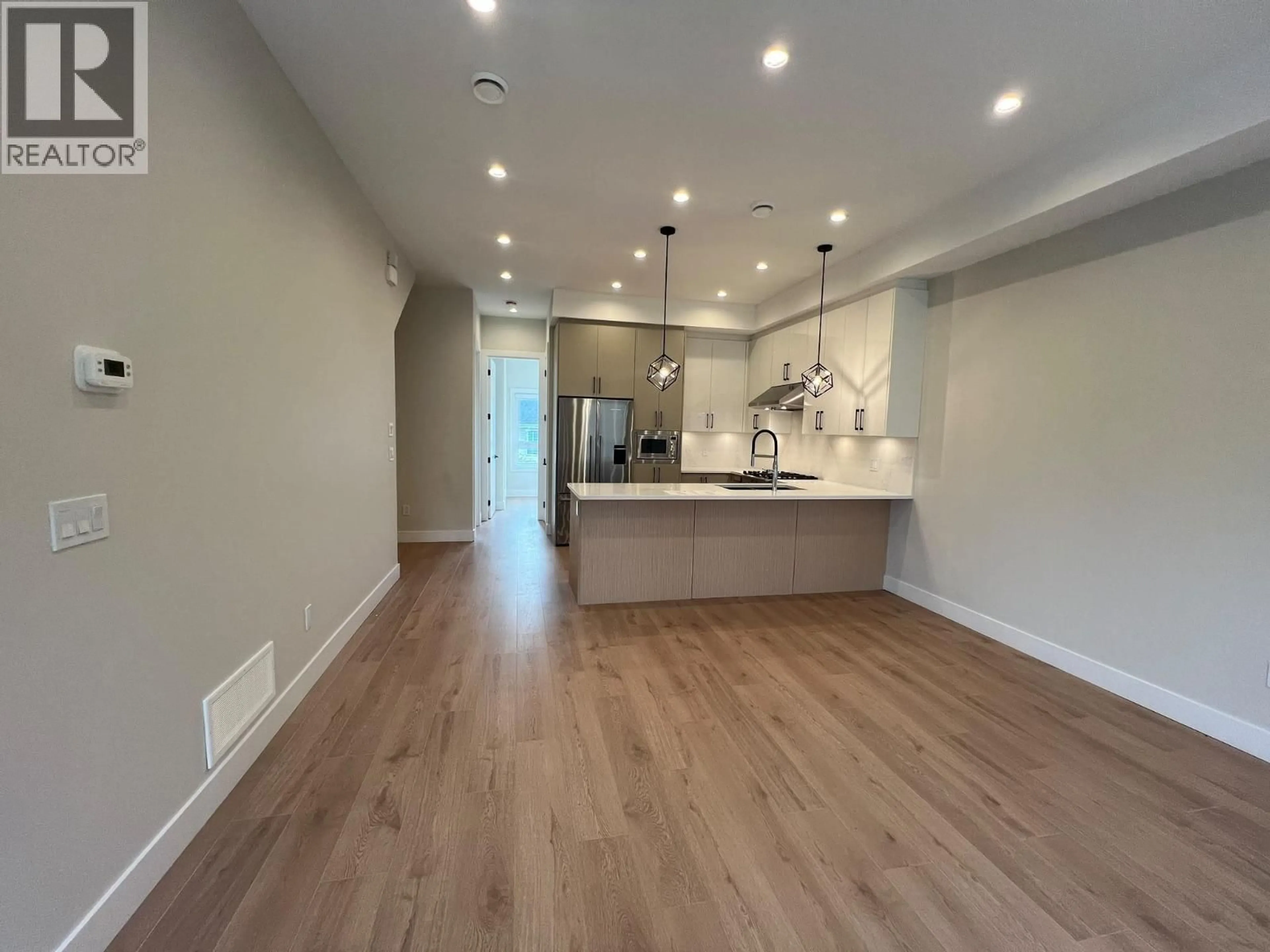 Open concept kitchen, wood/laminate floor for 15 - 3033 SHELL ROAD, Richmond British Columbia V6X0B8