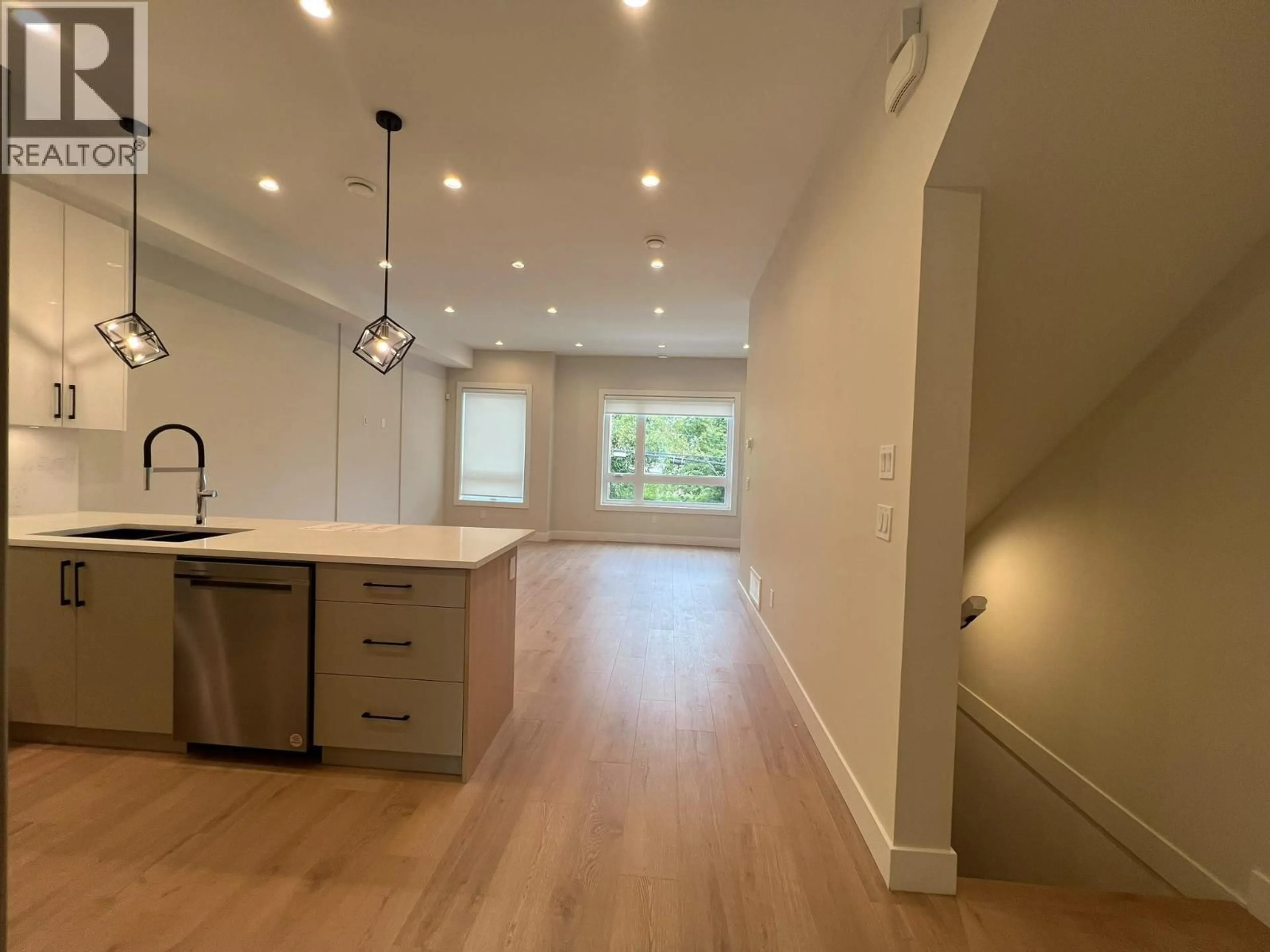 Open concept kitchen, wood/laminate floor for 15 - 3033 SHELL ROAD, Richmond British Columbia V6X0B8