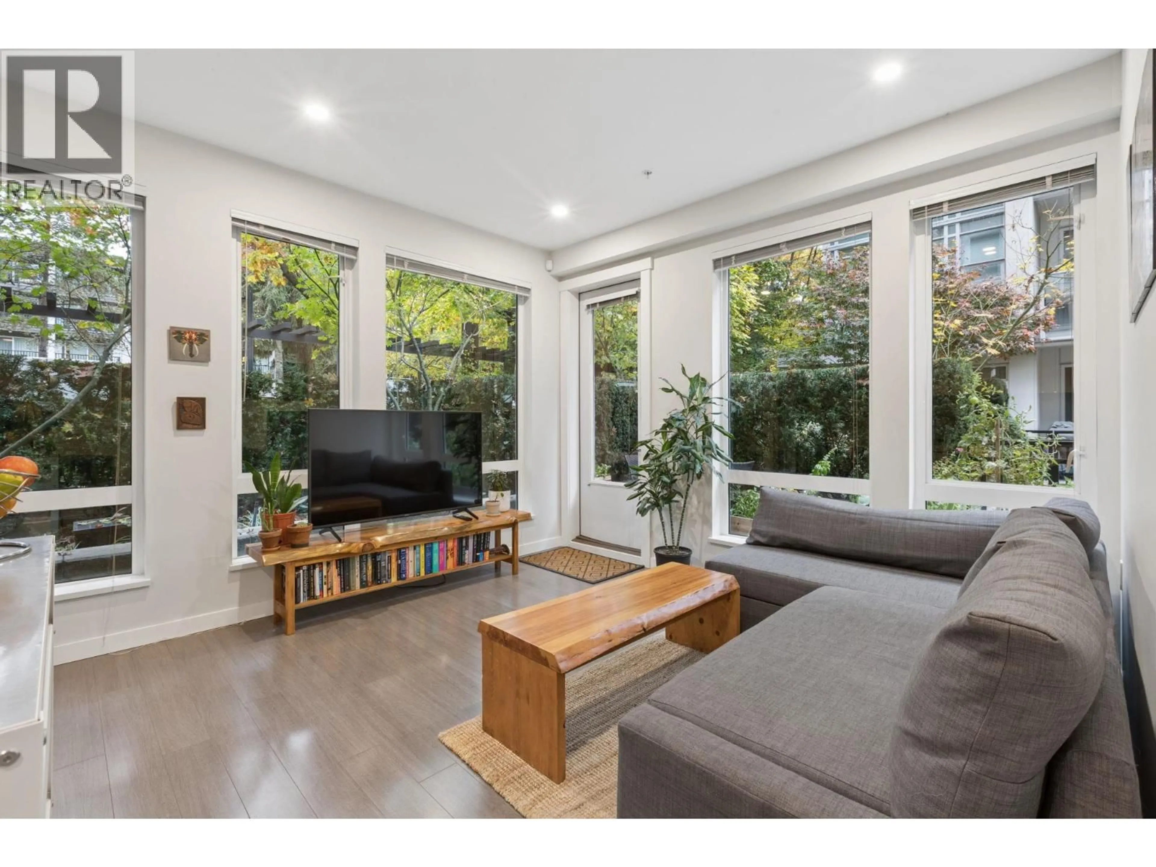 Living room with furniture, wood/laminate floor for 113 - 277 1ST STREET, North Vancouver British Columbia V7M0E8