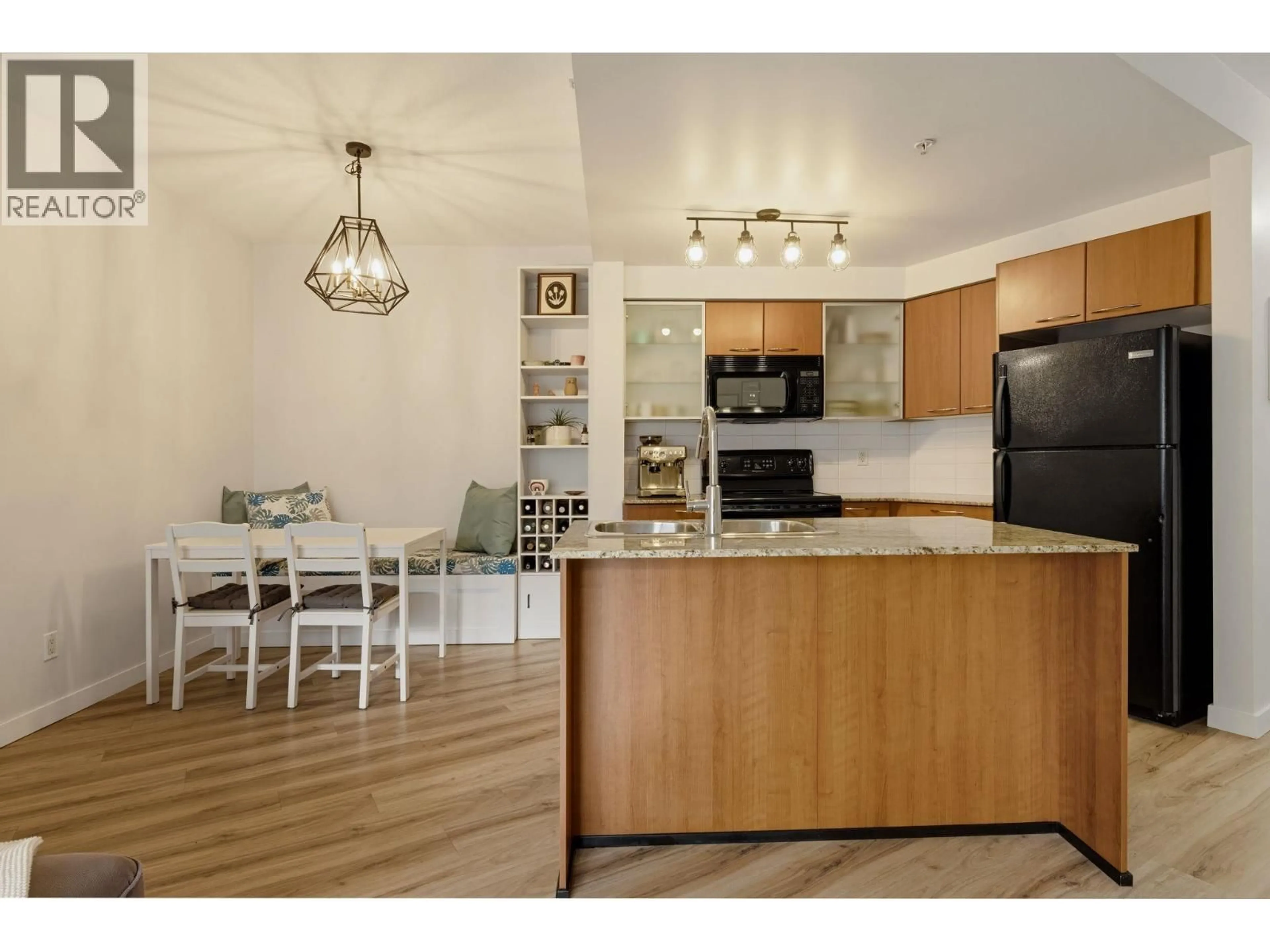 Open concept kitchen, wood/laminate floor for 321 - 4028 KNIGHT STREET, Vancouver British Columbia V5N5Y8