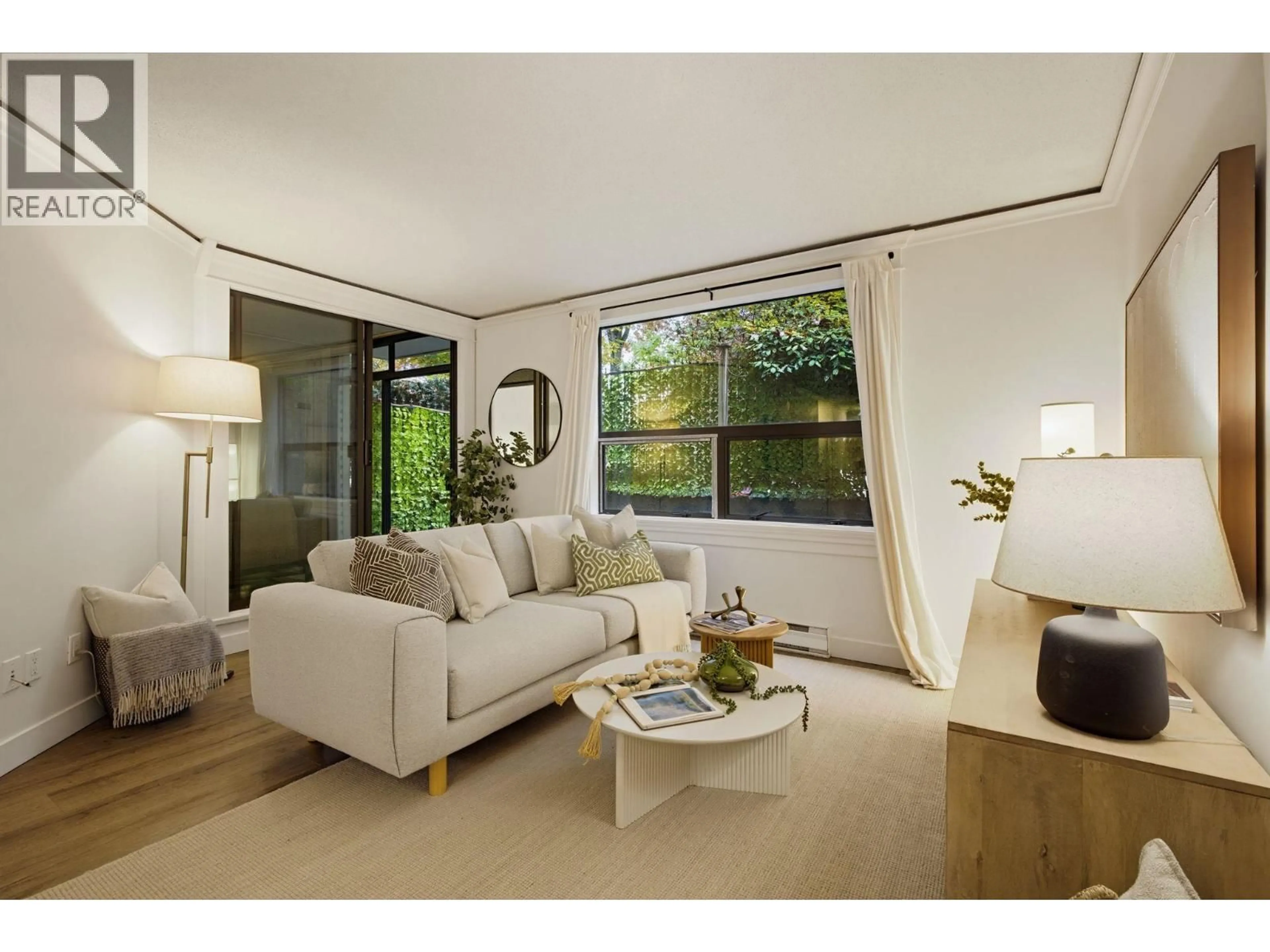 Living room with furniture, wood/laminate floor for 203 - 1350 COMOX STREET, Vancouver British Columbia V6E4E1