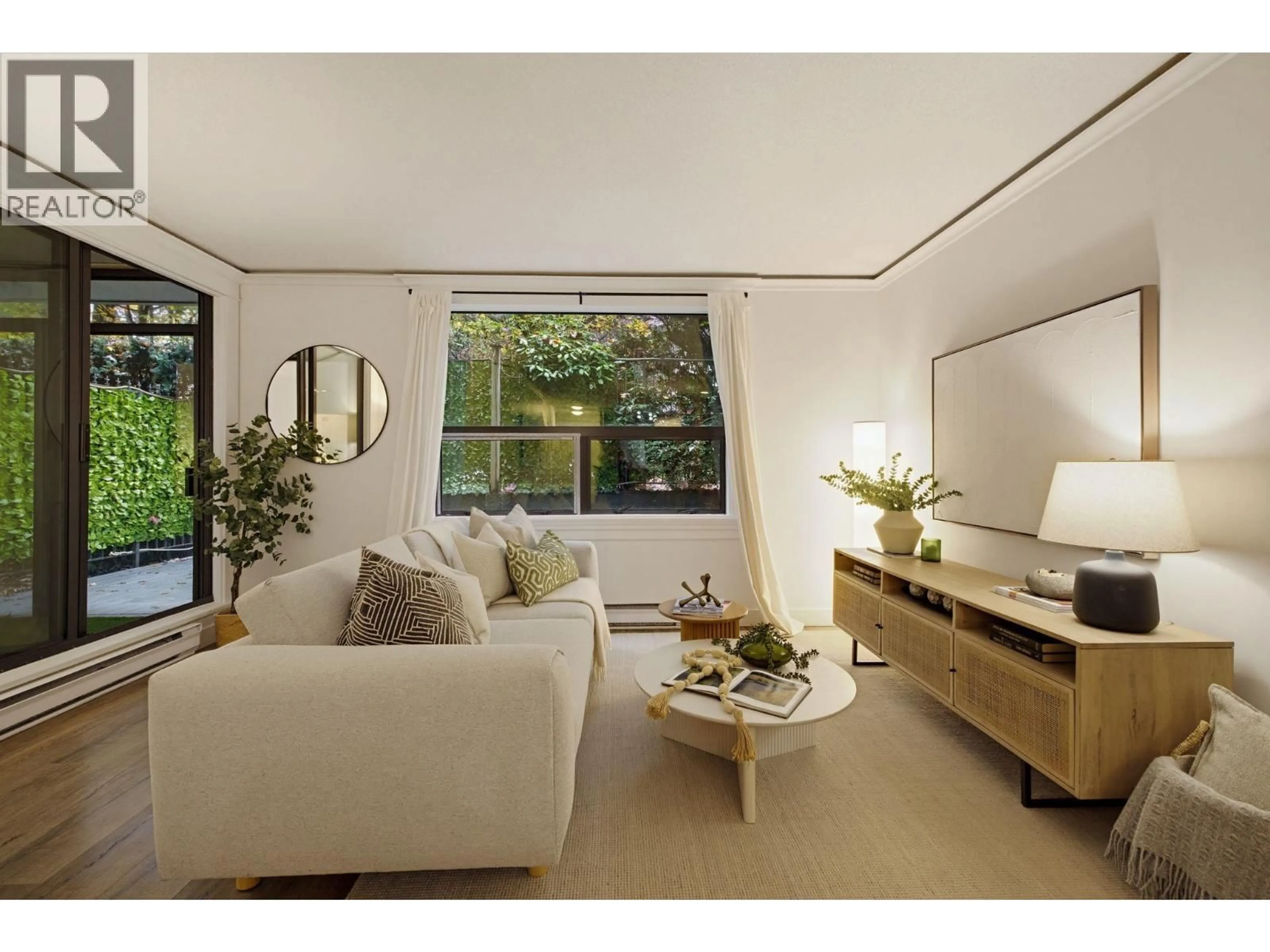 Living room with furniture, wood/laminate floor for 203 - 1350 COMOX STREET, Vancouver British Columbia V6E4E1