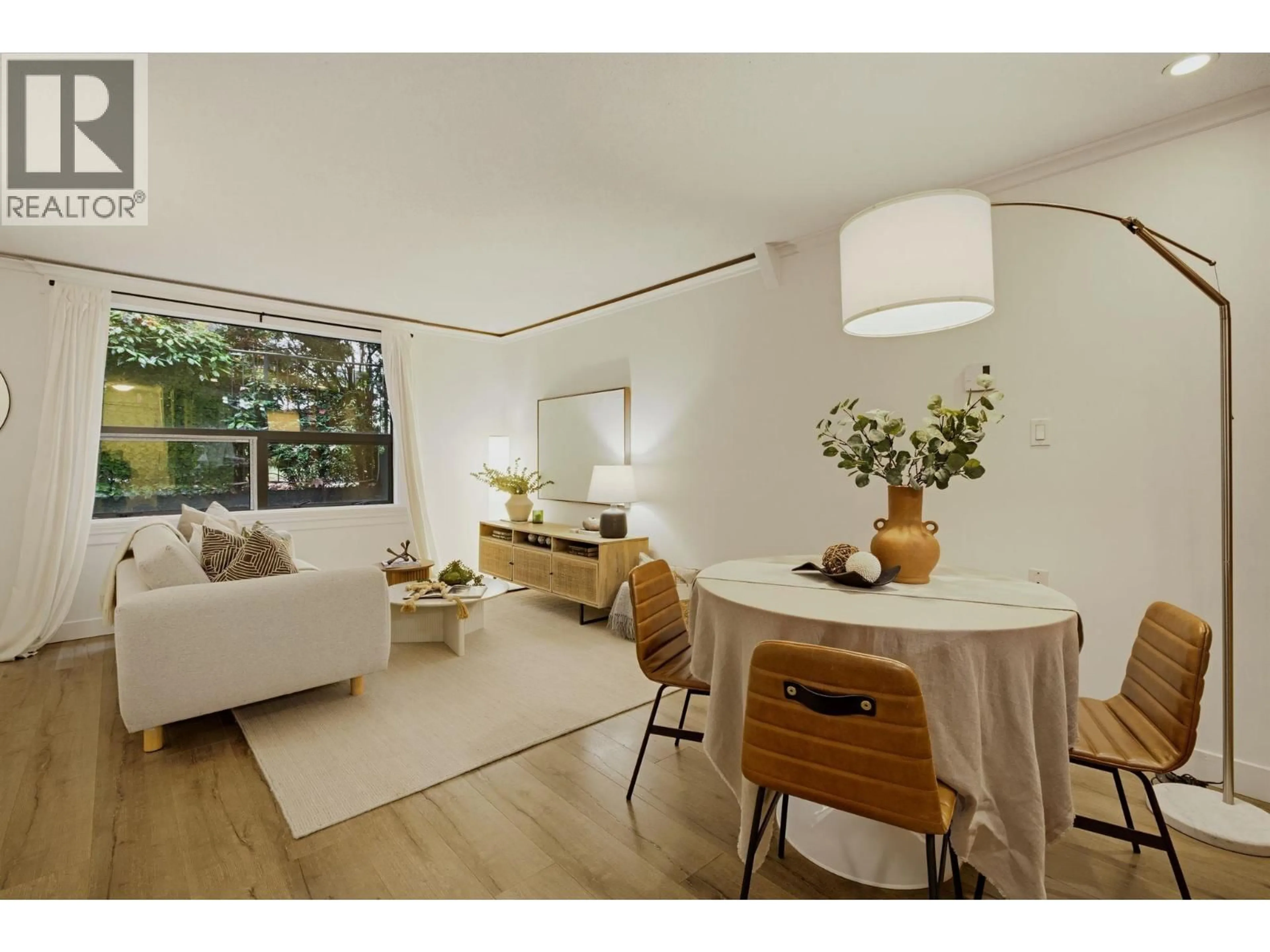 Living room with furniture, wood/laminate floor for 203 - 1350 COMOX STREET, Vancouver British Columbia V6E4E1