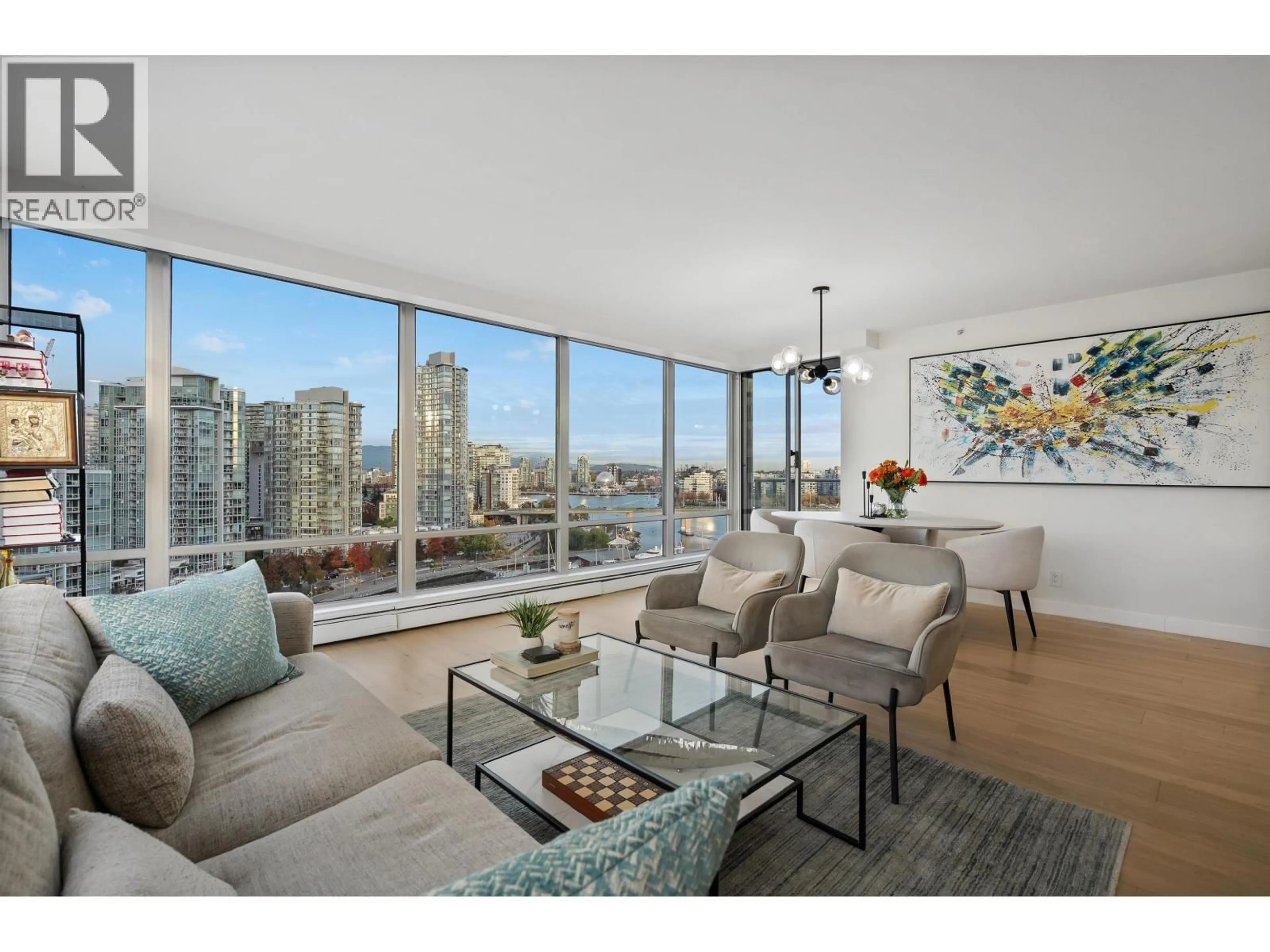 Living room with furniture, wood/laminate floor for 1706 - 1228 MARINASIDE CRESCENT, Vancouver British Columbia V6Z2W4