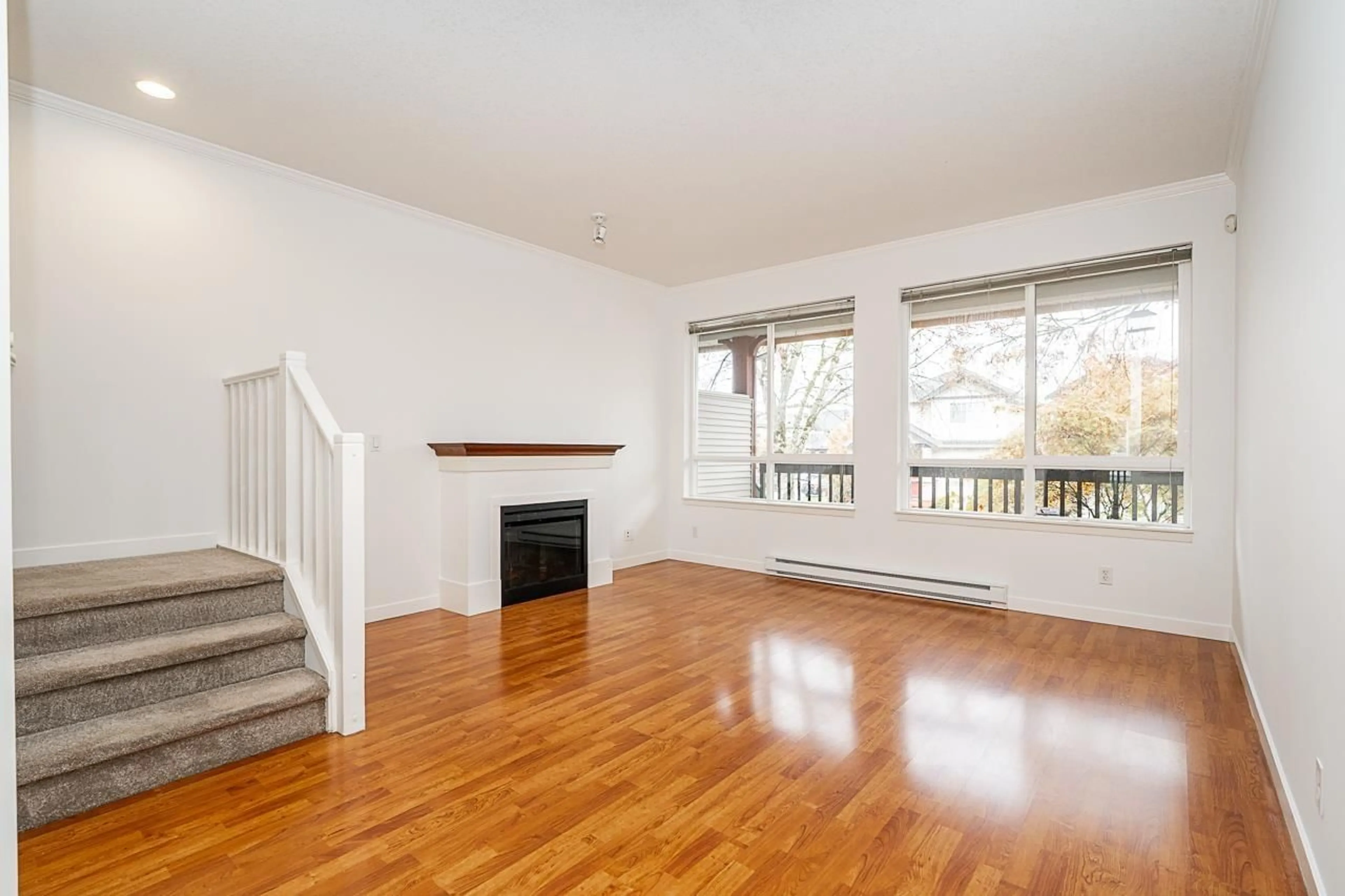 Living room with furniture, wood/laminate floor for 35 - 16772 61 AVENUE, Surrey British Columbia V3S4P2