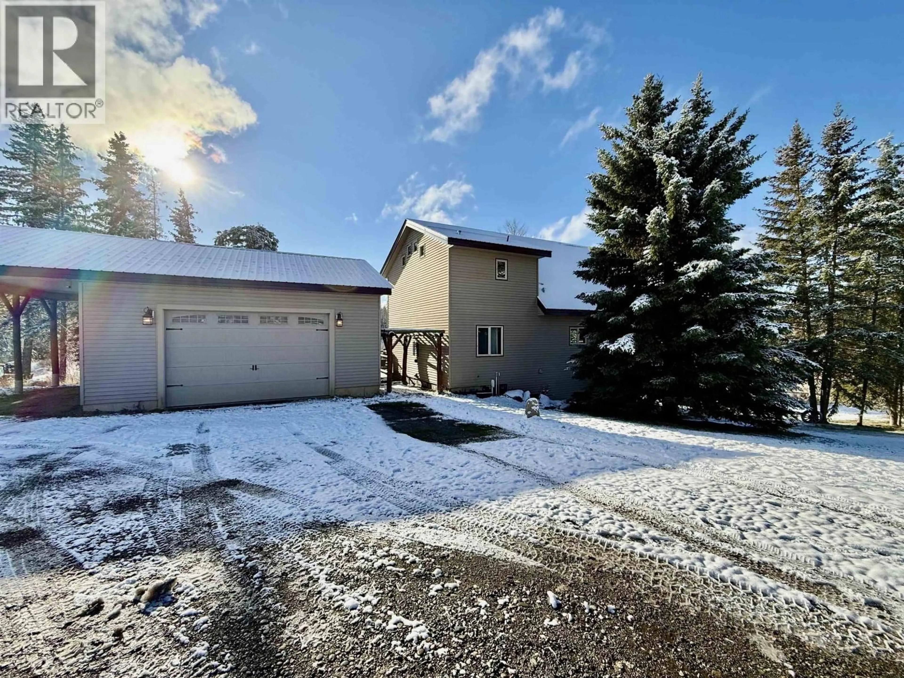 A pic from outside/outdoor area/front of a property/back of a property/a pic from drone, unknown for 3722 SPOKIN LAKE ROAD, 150 Mile House British Columbia V0K2G0