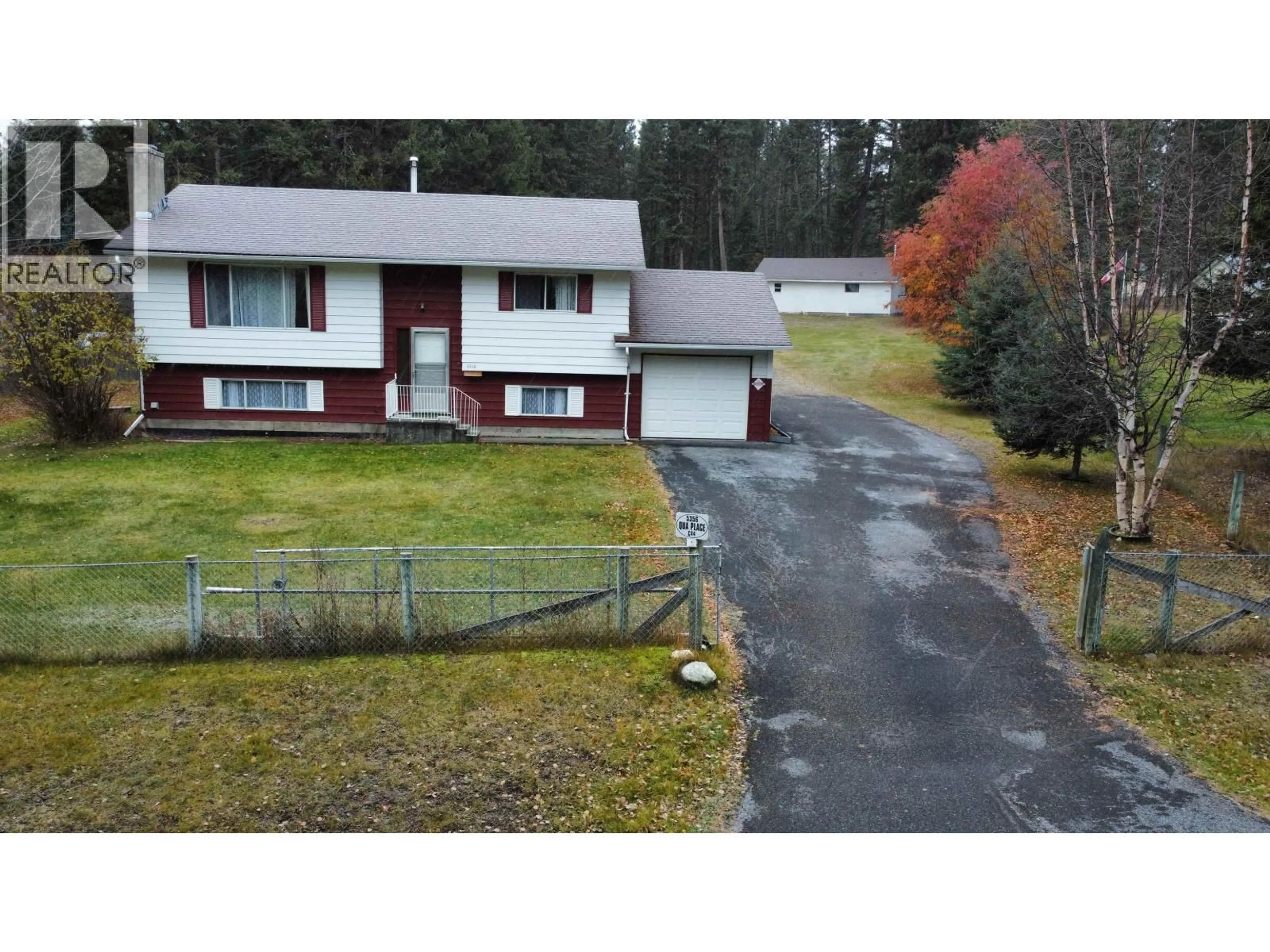 A pic from outside/outdoor area/front of a property/back of a property/a pic from drone, unknown for 5356 QUA PLACE, 108 Mile Ranch British Columbia V0K2Z0