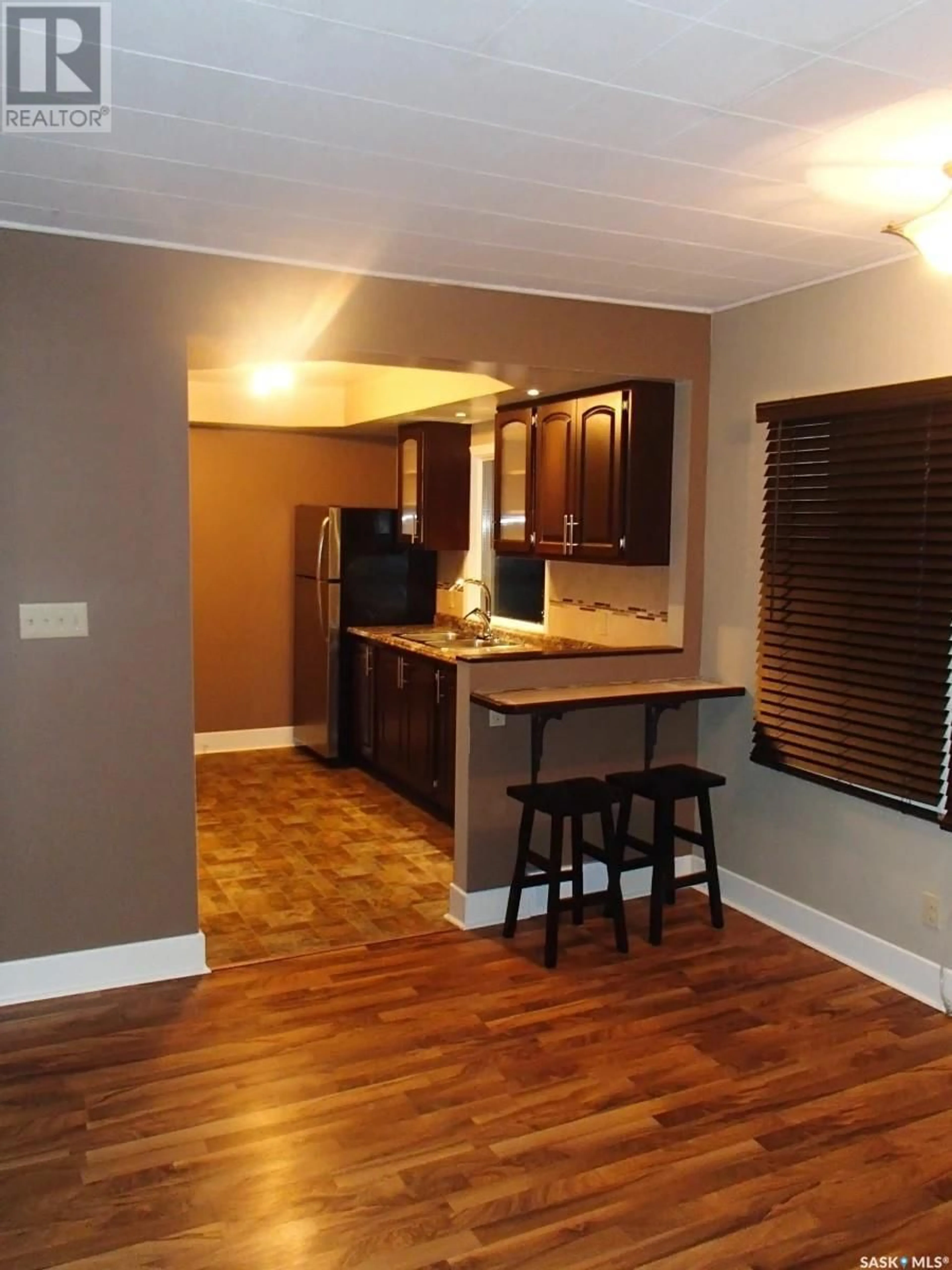 Open concept kitchen, wood/laminate floor for 375 22ND STREET, Prince Albert Saskatchewan S6V4K5