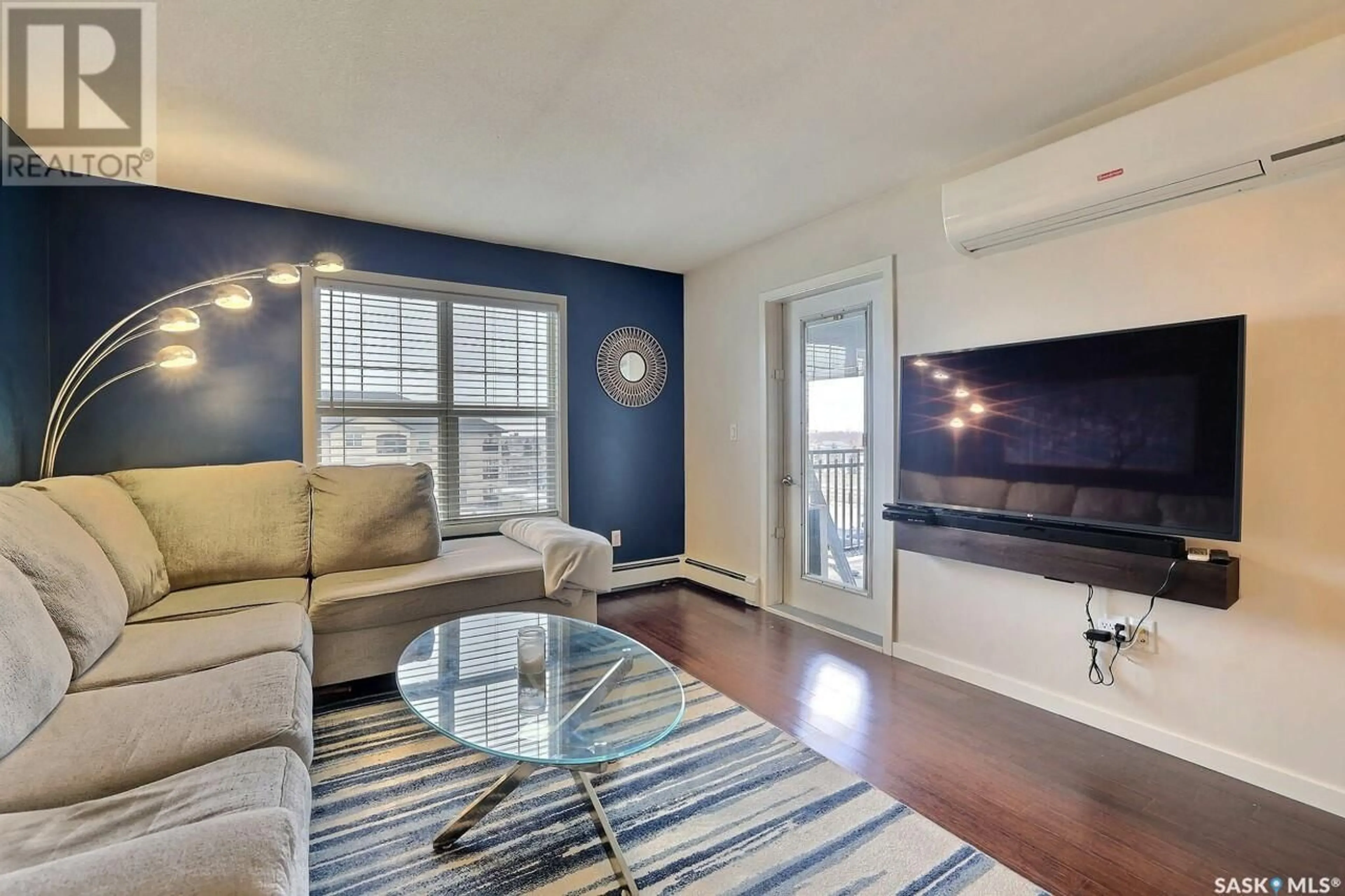 Living room with furniture, wood/laminate floor for 318 - 1510 NEVILLE DRIVE, Regina Saskatchewan S4Z0A3