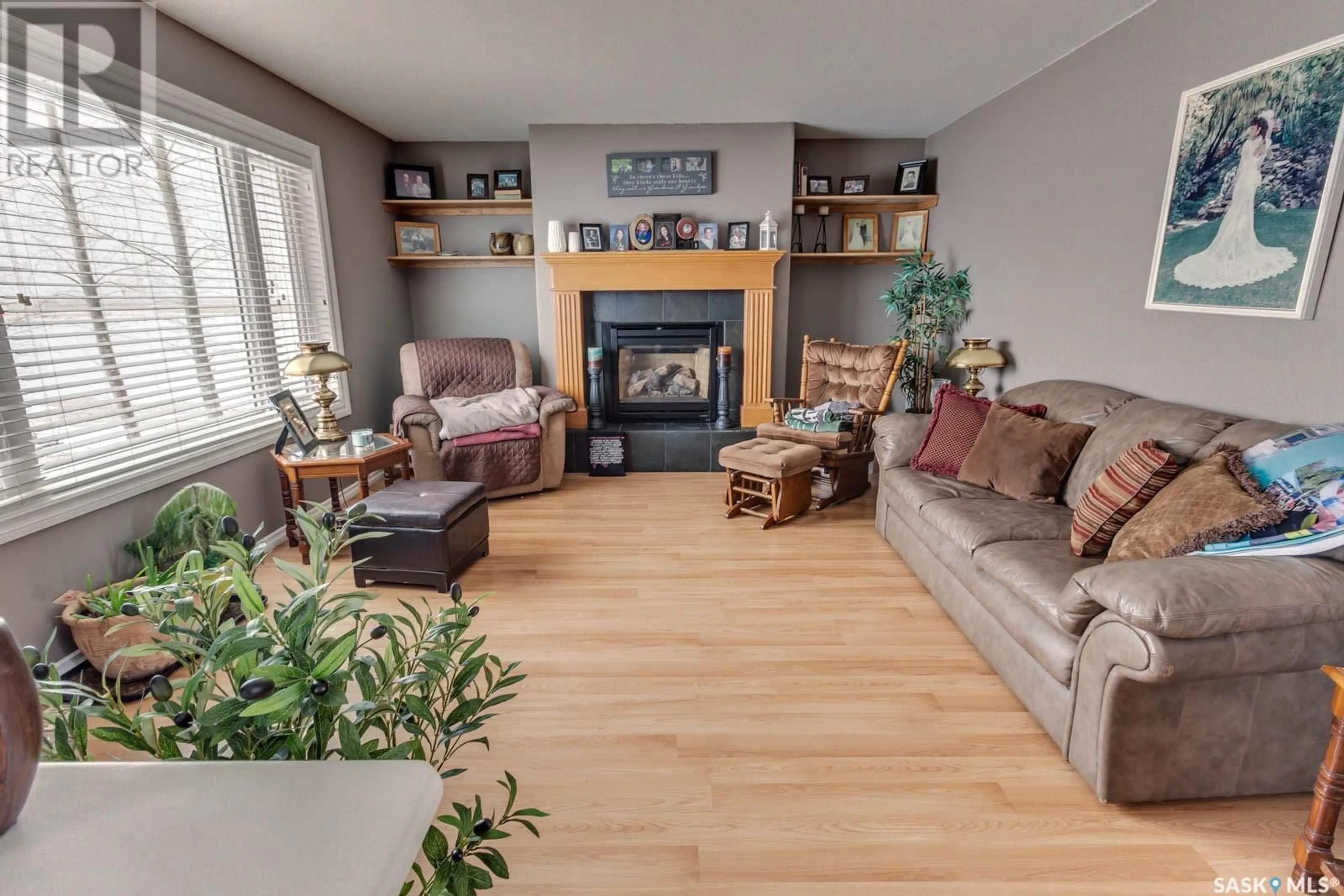 Living room with furniture, wood/laminate floor for 319 WILTON STREET, Bethune Saskatchewan S0G0H0