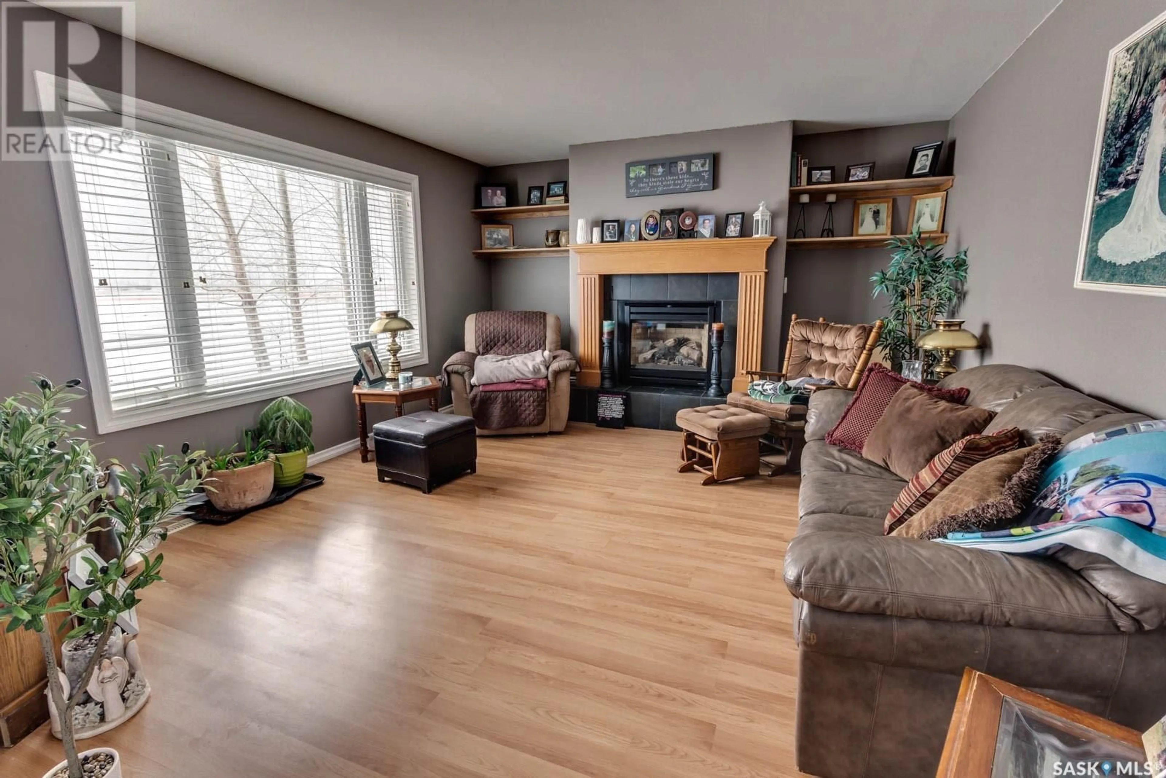 Living room with furniture, wood/laminate floor for 319 WILTON STREET, Bethune Saskatchewan S0G0H0