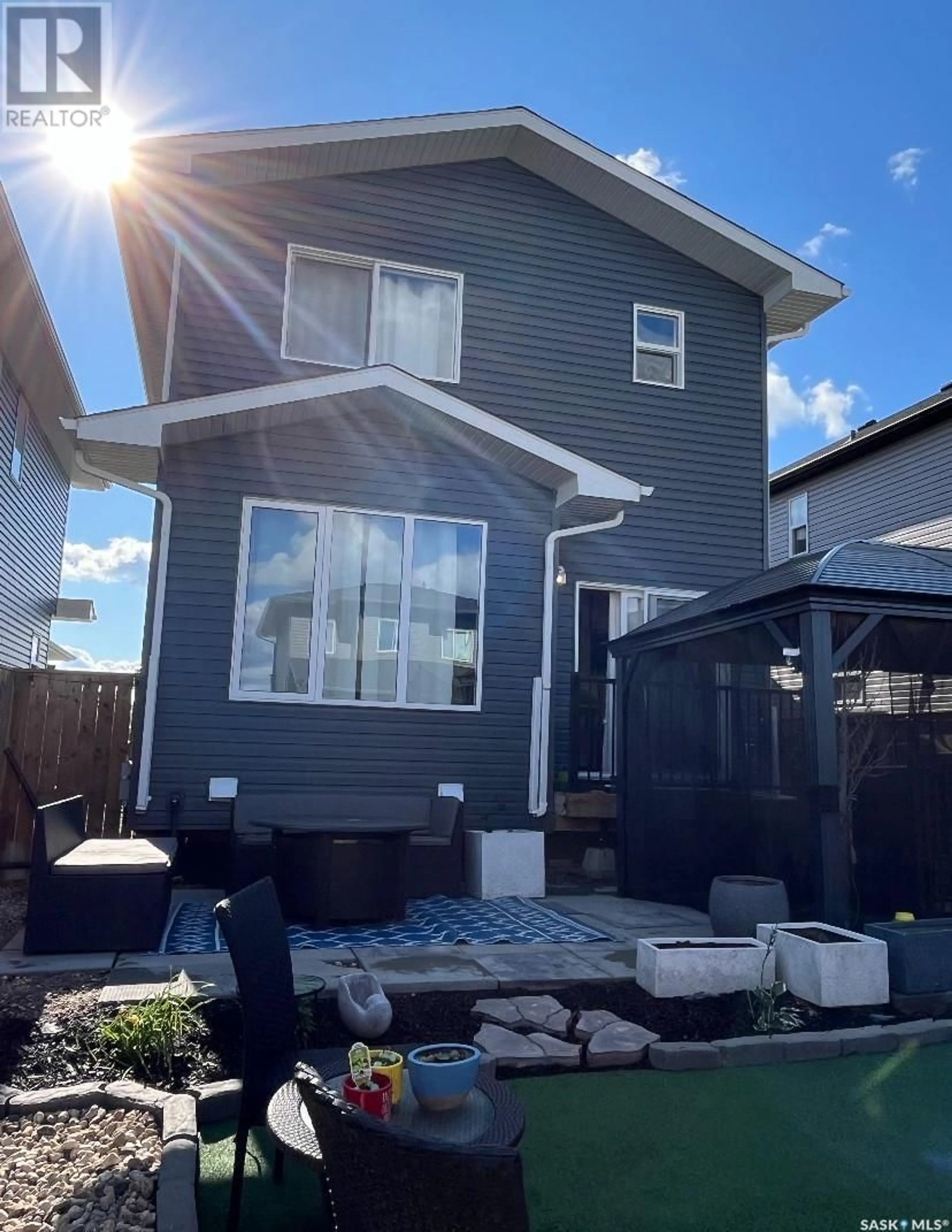 Home with vinyl exterior material, street for 215 SKOPIK CRESCENT, Saskatoon Saskatchewan S7V0V7