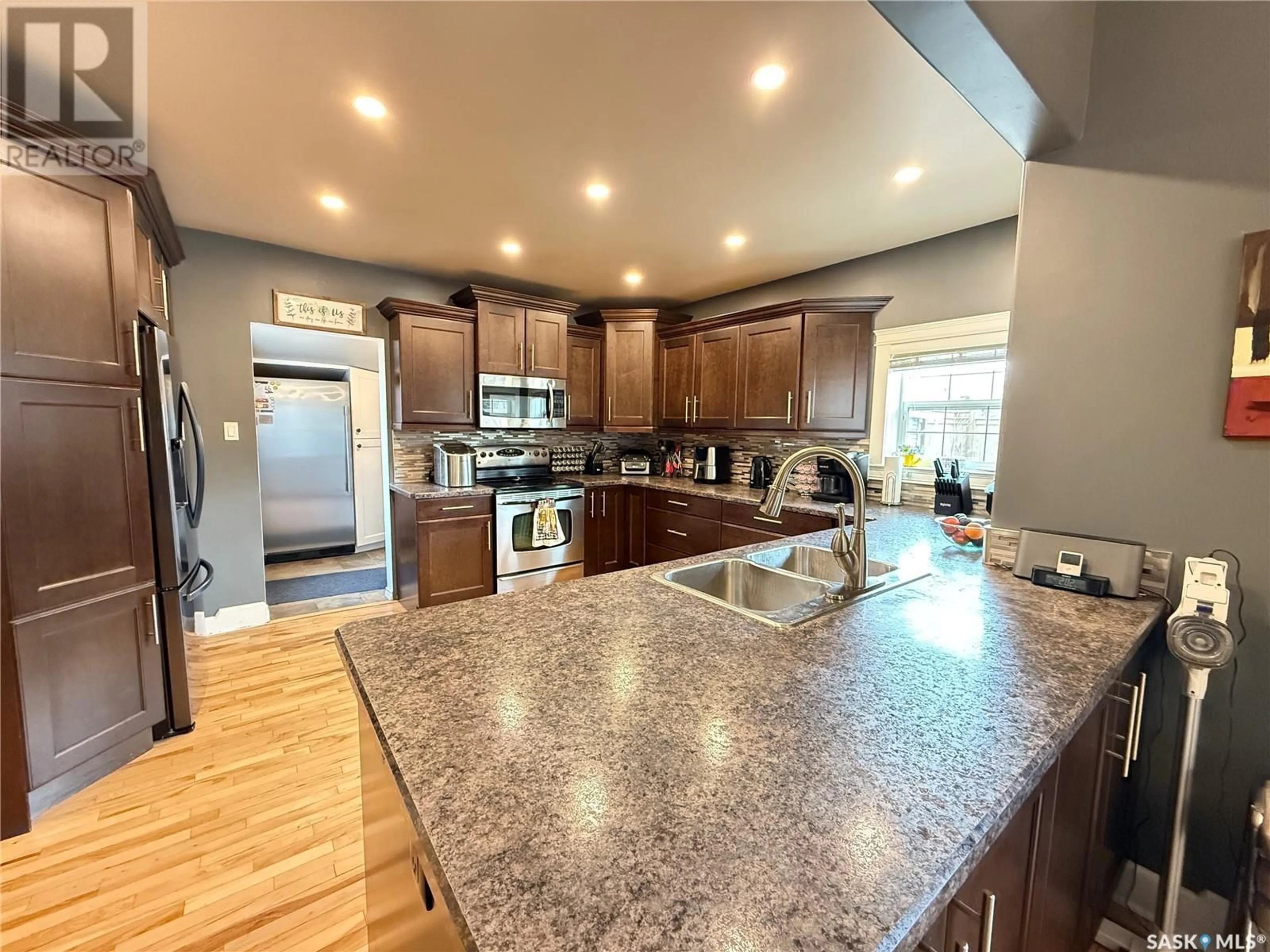 Open concept kitchen, ceramic/tile floor for 214 3RD STREET, Weyburn Saskatchewan S4H2C3