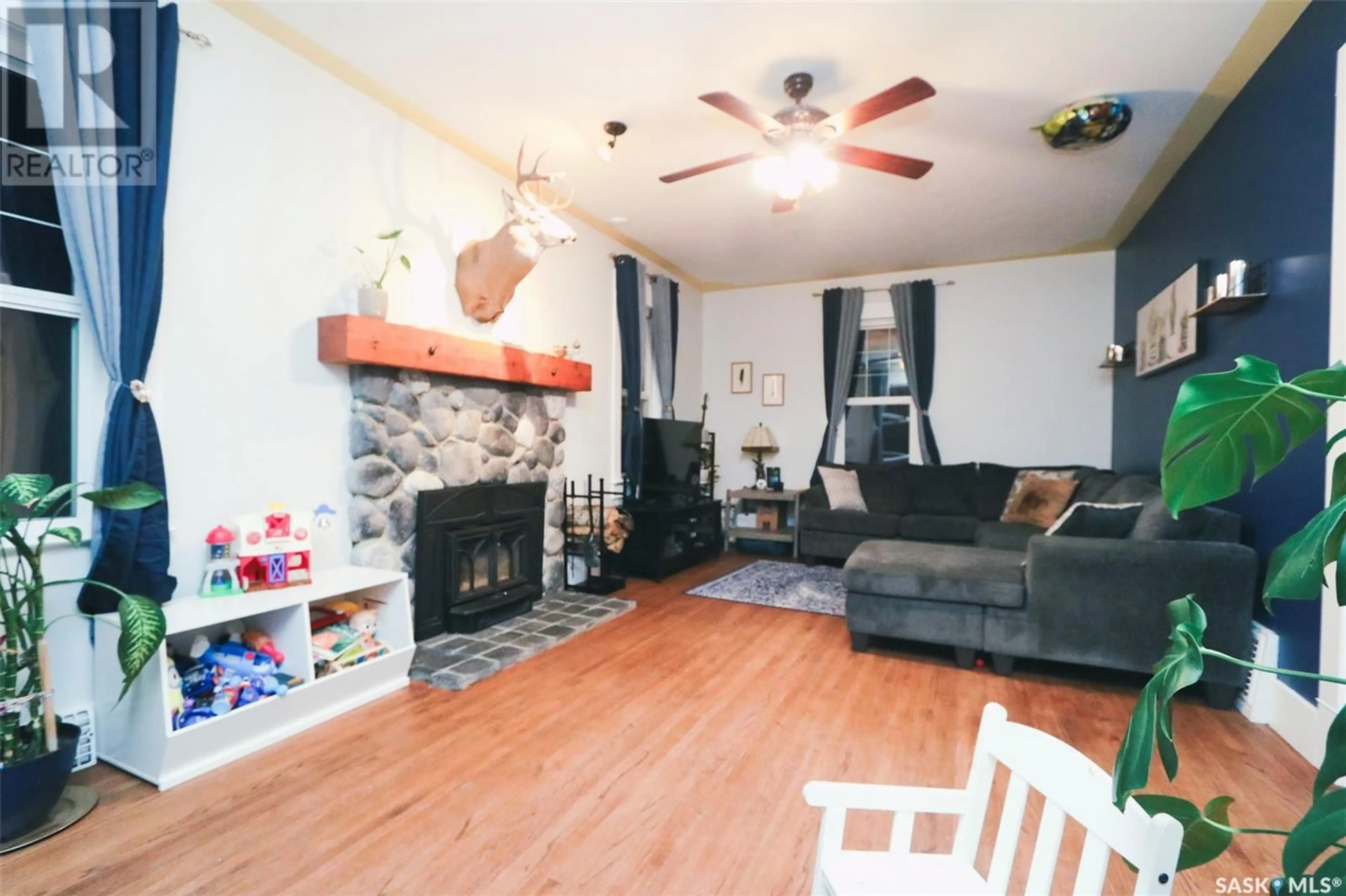 Living room with furniture, wood/laminate floor for 76 THIRD AVENUE, Yorkton Saskatchewan S3N1C3