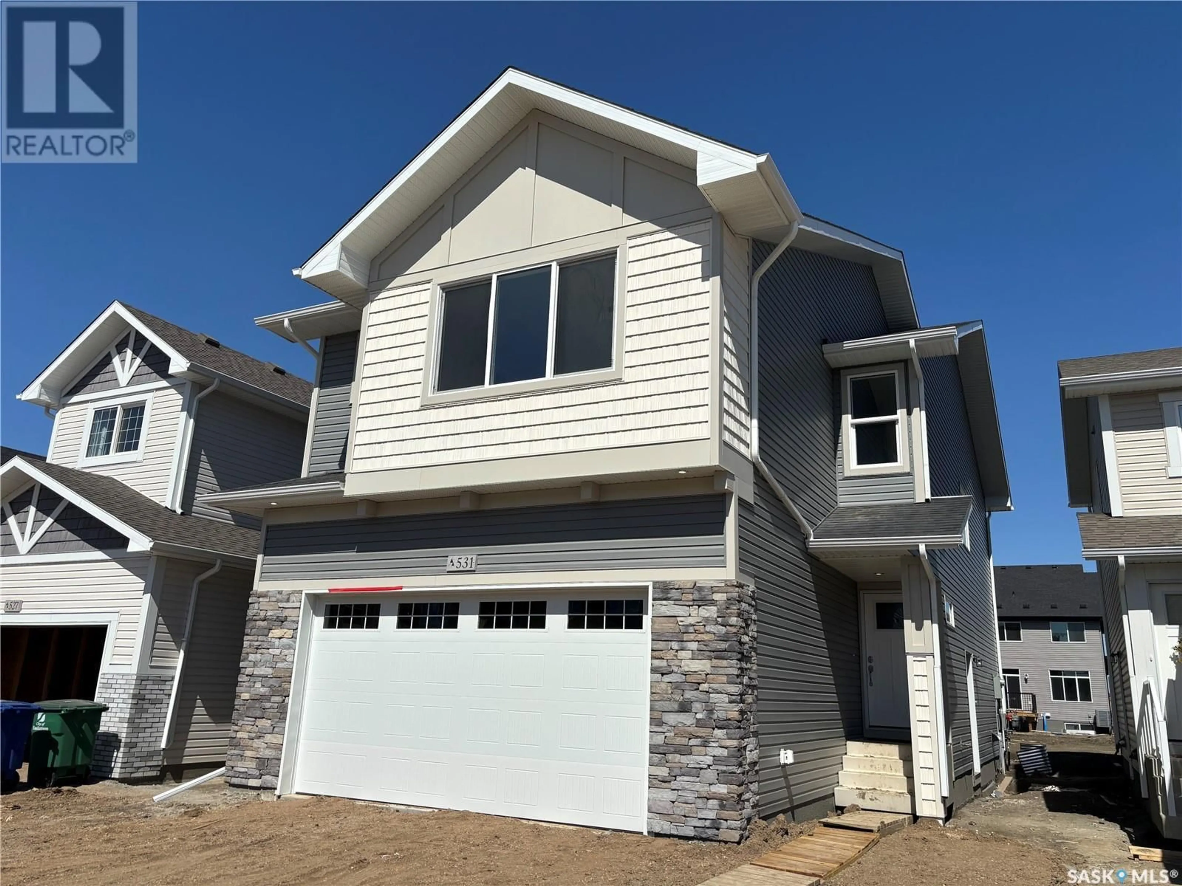 Home with vinyl exterior material, street for 531 MYLES HEIDT MANOR, Saskatoon Saskatchewan S7W1J2