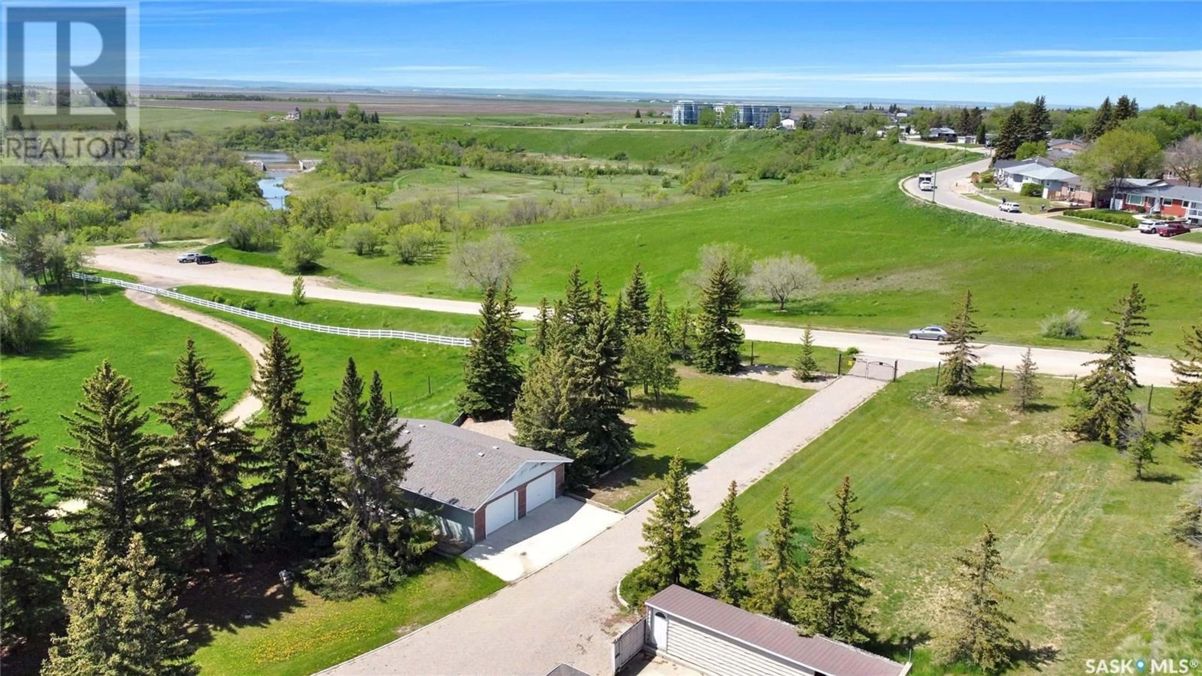 A pic from outside/outdoor area/front of a property/back of a property/a pic from drone, water/lake/river/ocean view for 1055 7TH AVENUE, Moose Jaw Saskatchewan S6H5R2