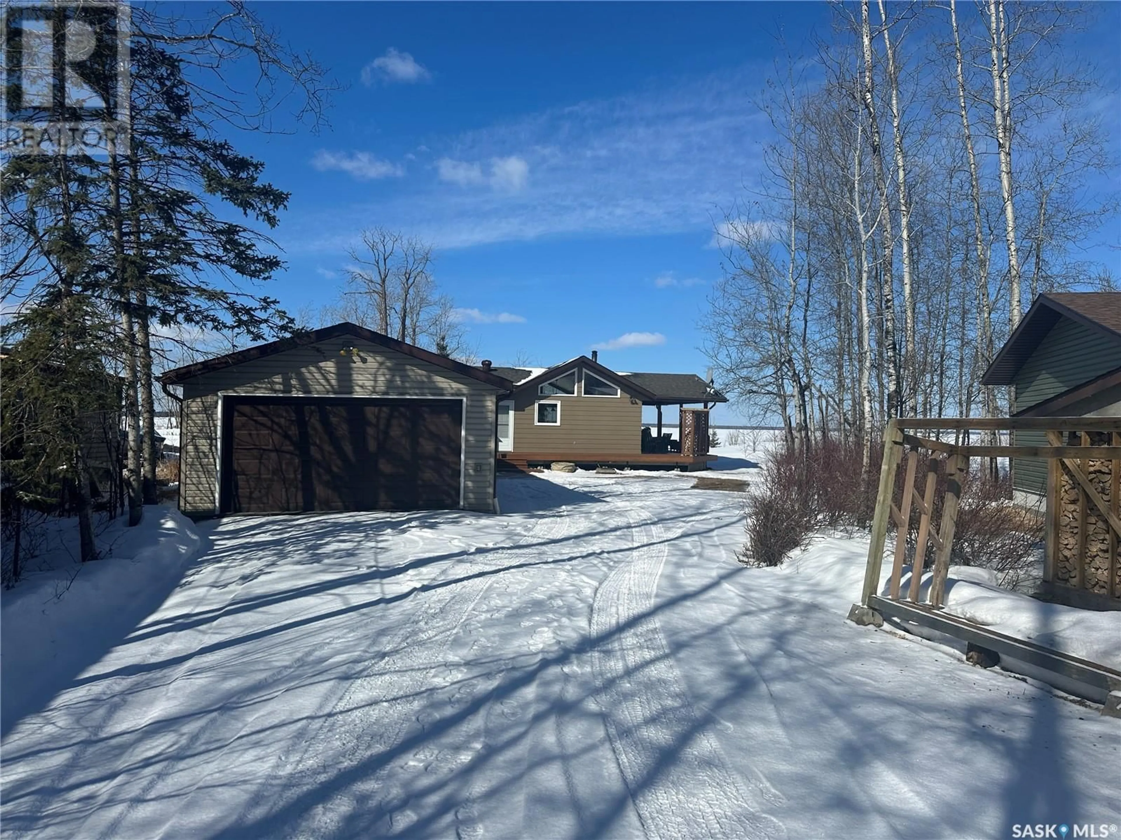 A pic from outside/outdoor area/front of a property/back of a property/a pic from drone, street for 24 DELARONDE TERRACE, Delaronde Lake Saskatchewan S0J0E0