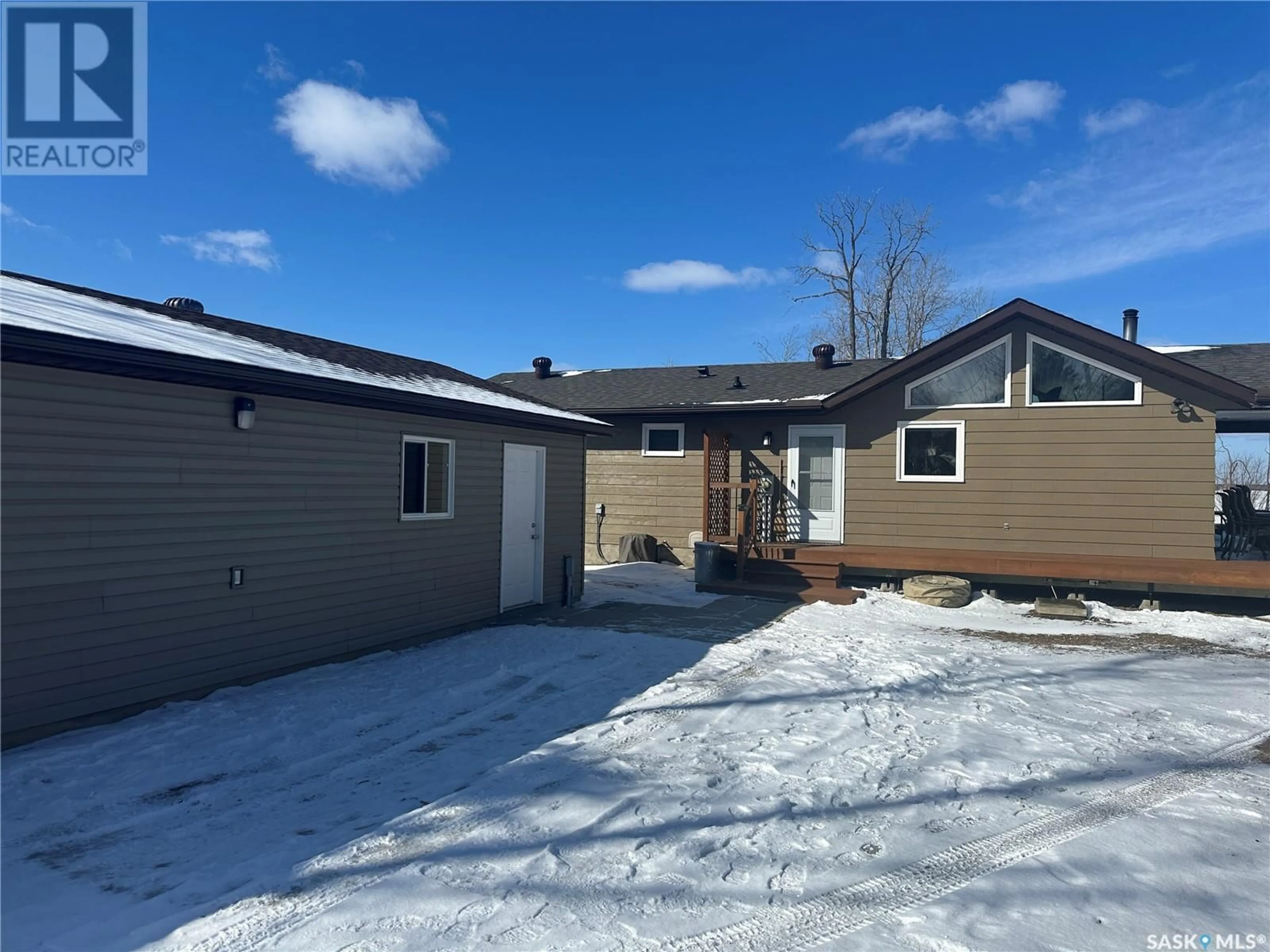 Home with vinyl exterior material, street for 24 DELARONDE TERRACE, Delaronde Lake Saskatchewan S0J0E0
