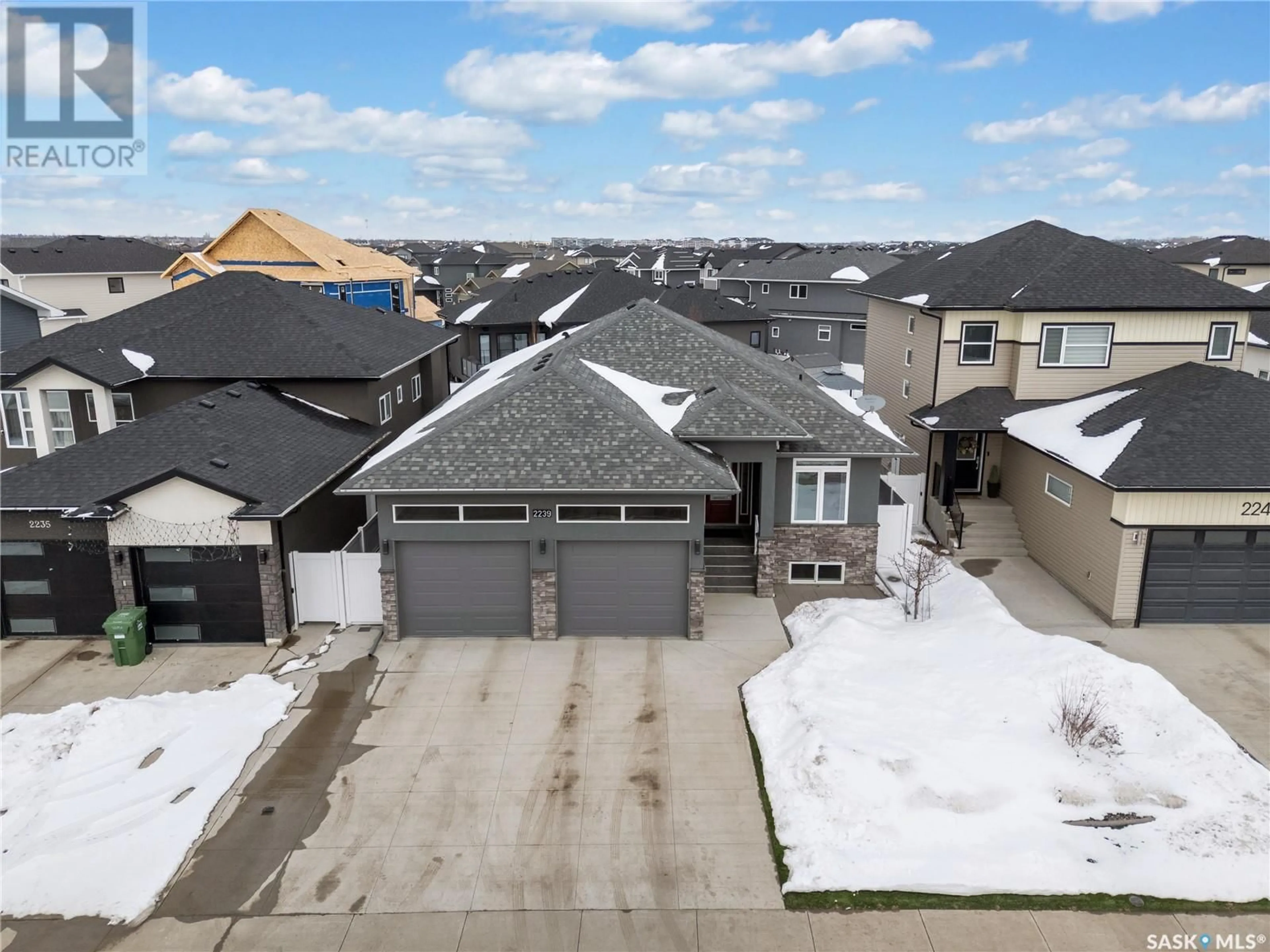 A pic from outside/outdoor area/front of a property/back of a property/a pic from drone, street for 2239 ROSEWOOD DRIVE, Saskatoon Saskatchewan S7V0R9