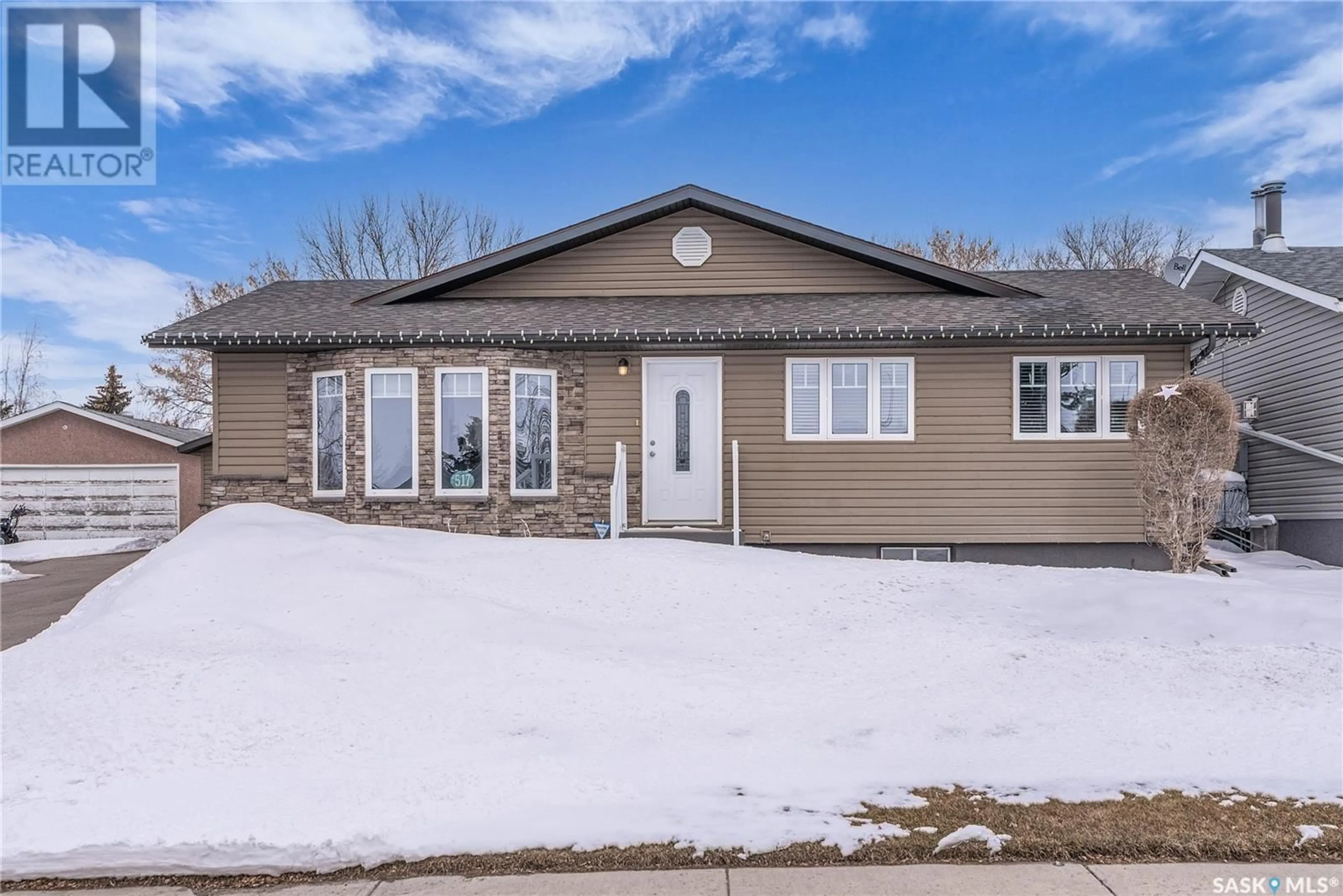 Home with vinyl exterior material, street for 517 8TH AVENUE, Biggar Saskatchewan S0K0M0