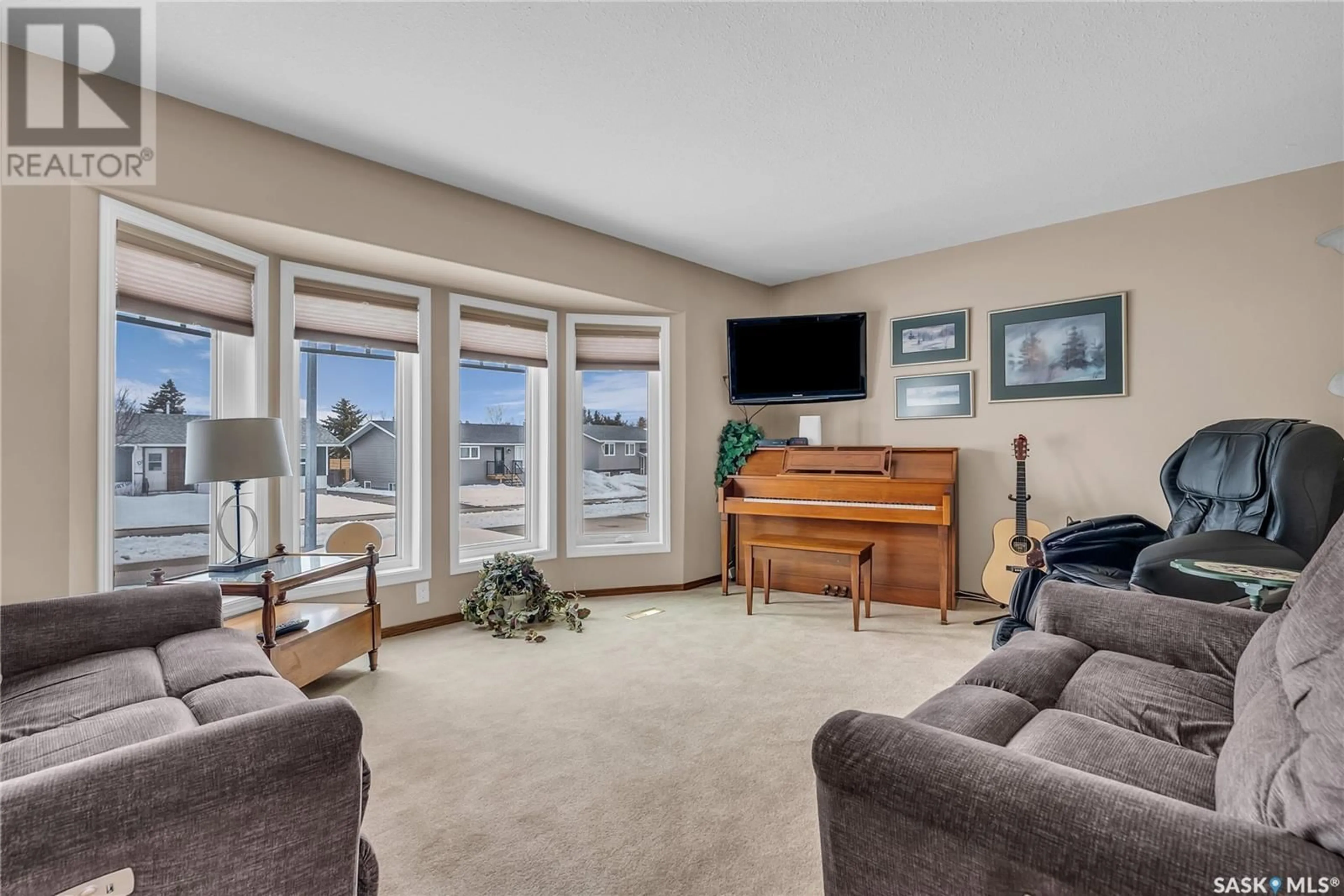 Living room with furniture, carpet floor for 517 8TH AVENUE, Biggar Saskatchewan S0K0M0