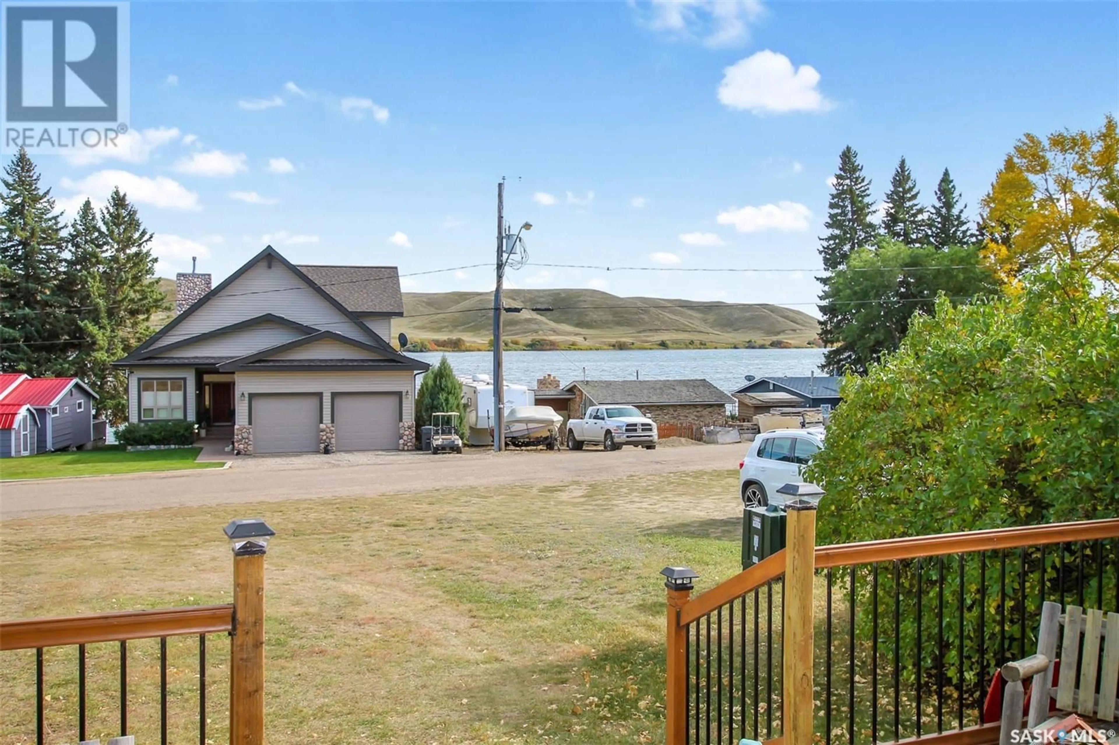 A pic from outside/outdoor area/front of a property/back of a property/a pic from drone, water/lake/river/ocean view for 202 WALL RIDGE TRAIL, Lac Pelletier Rm No. 107 Saskatchewan S0N2N0