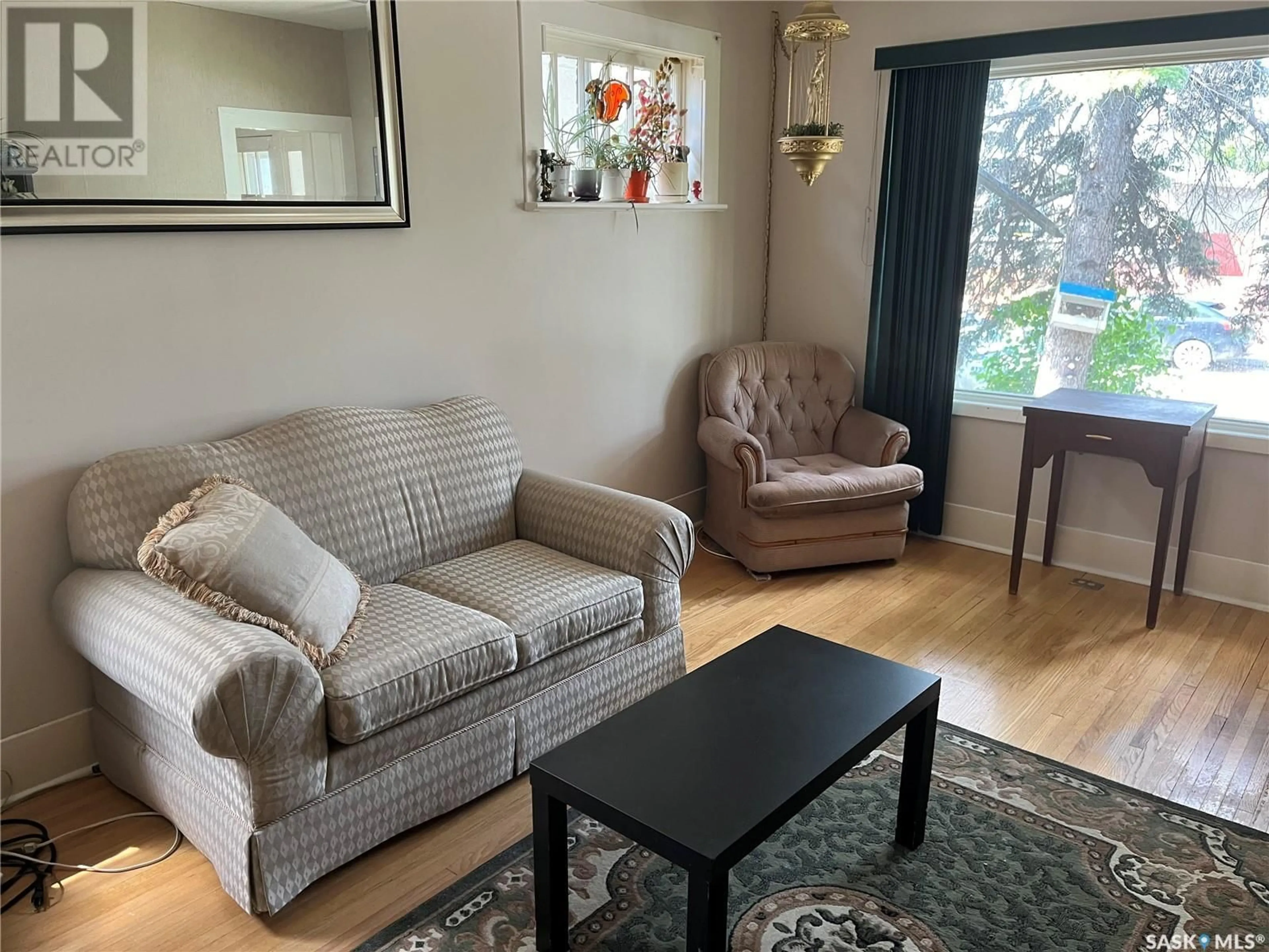 Living room with furniture, wood/laminate floor for 1931 REYNOLDS STREET, Regina Saskatchewan S4N3M6