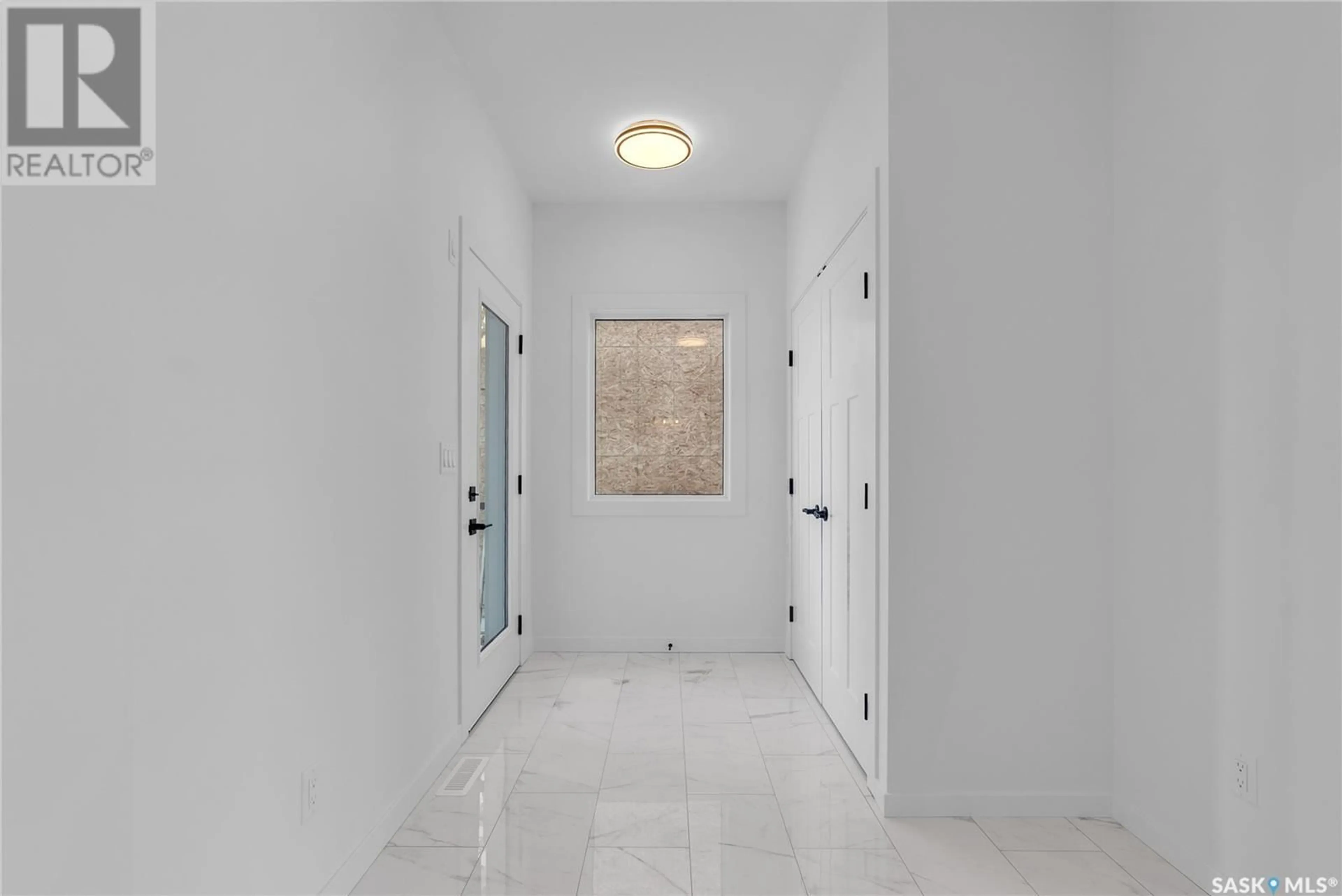 Indoor foyer for 347 SHARMA CRESCENT, Saskatoon Saskatchewan S7W1K9