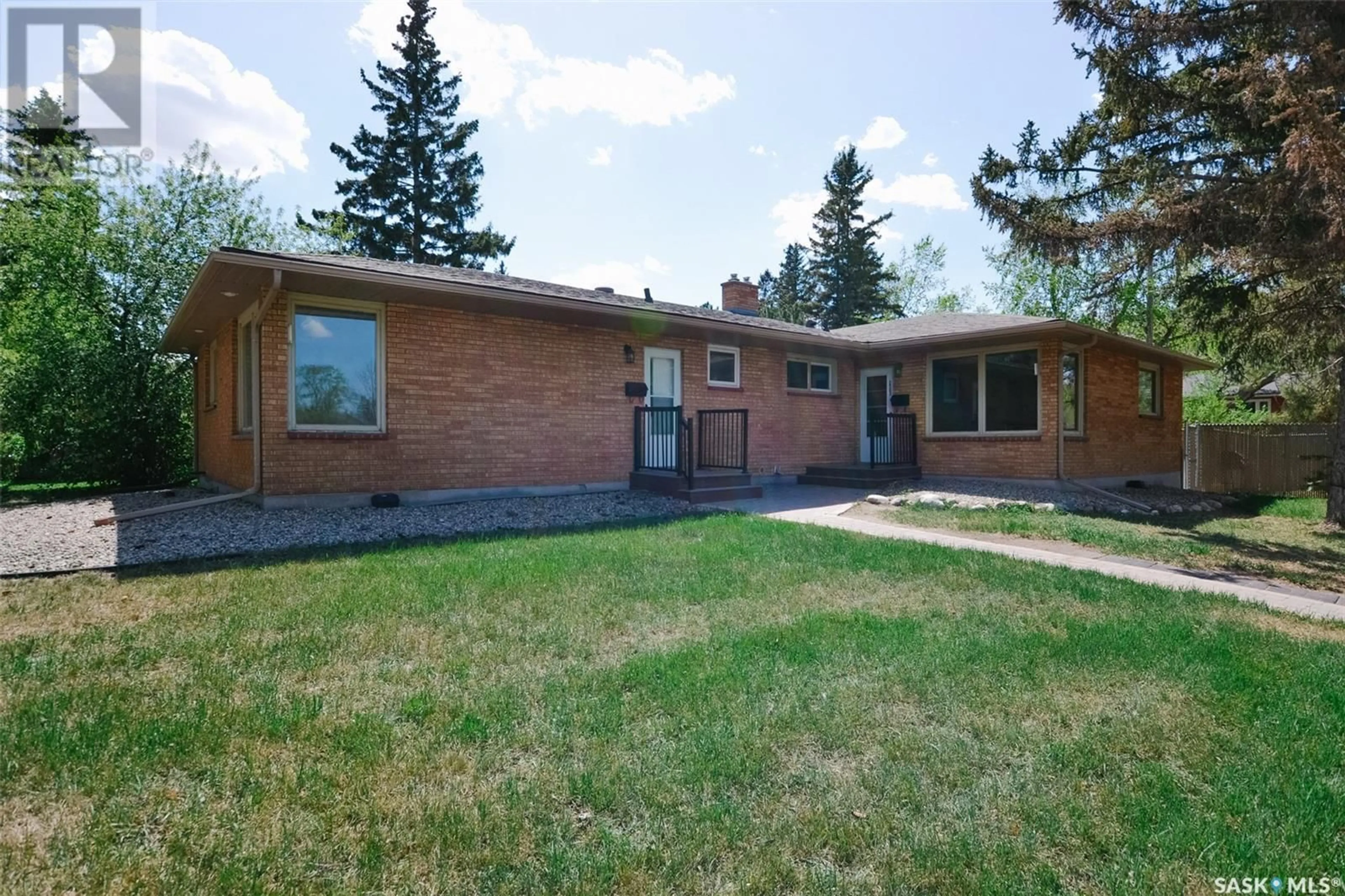 Home with brick exterior material, street for 2500-2502 ELPHINSTONE STREET, Regina Saskatchewan S4S0J6