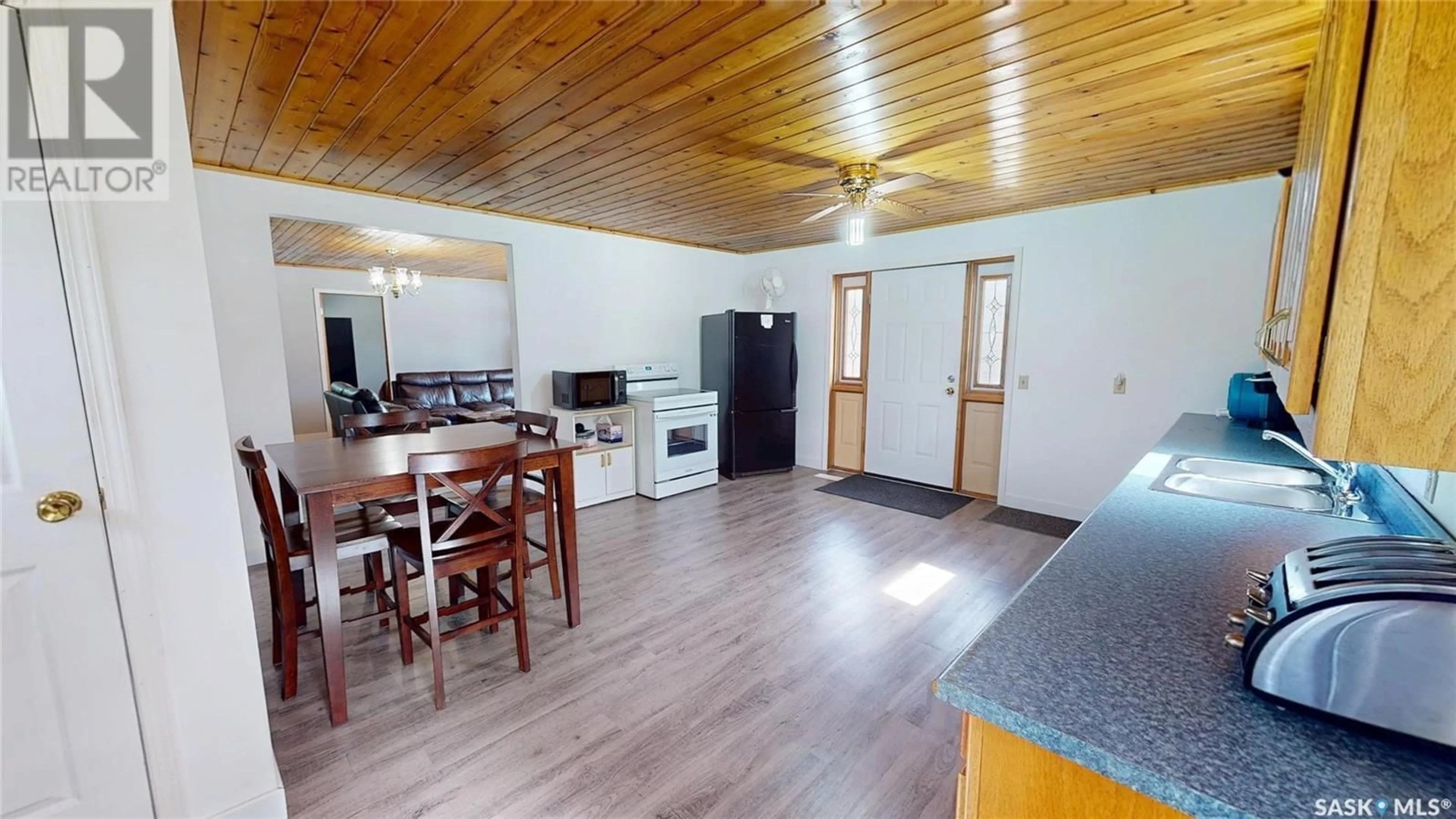 Open concept kitchen, wood/laminate floor for 391 GOOD BIRDS POINT, White Bear IR 70 Saskatchewan S0C2S0