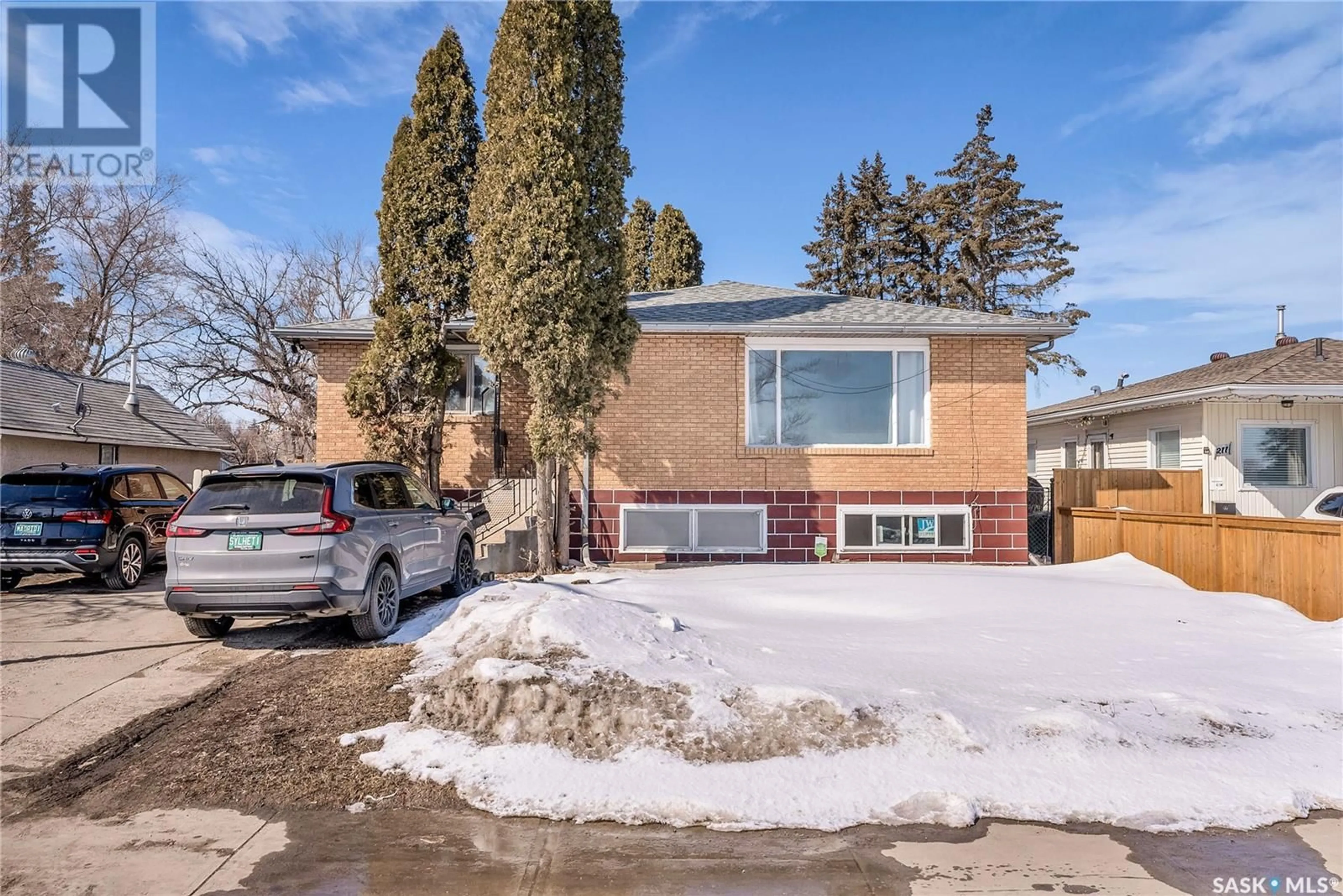 Home with brick exterior material, street for 205 P AVENUE, Saskatoon Saskatchewan S7L2V6