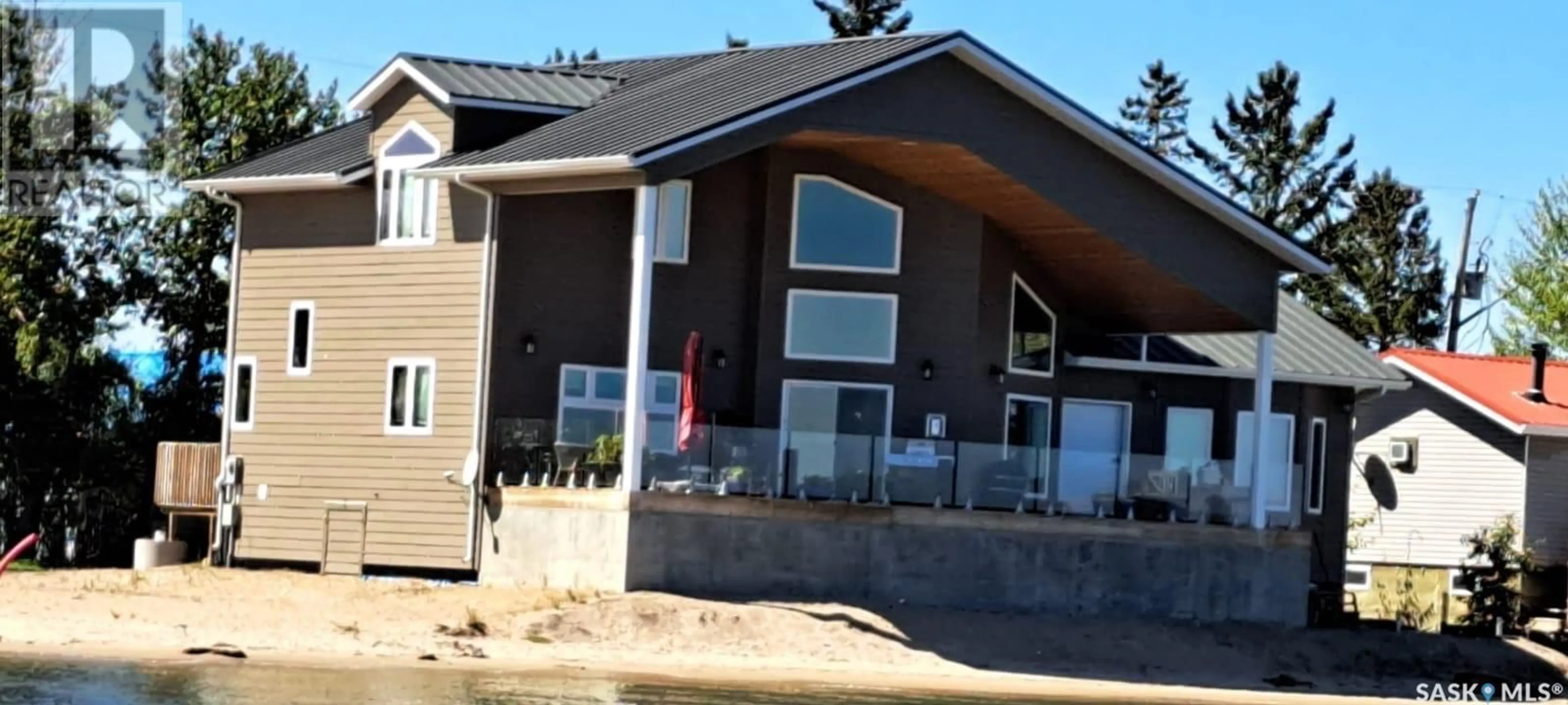 Home with vinyl exterior material, street for 106 LAKESHORE LANE, Leslie Beach Saskatchewan S0A1A0