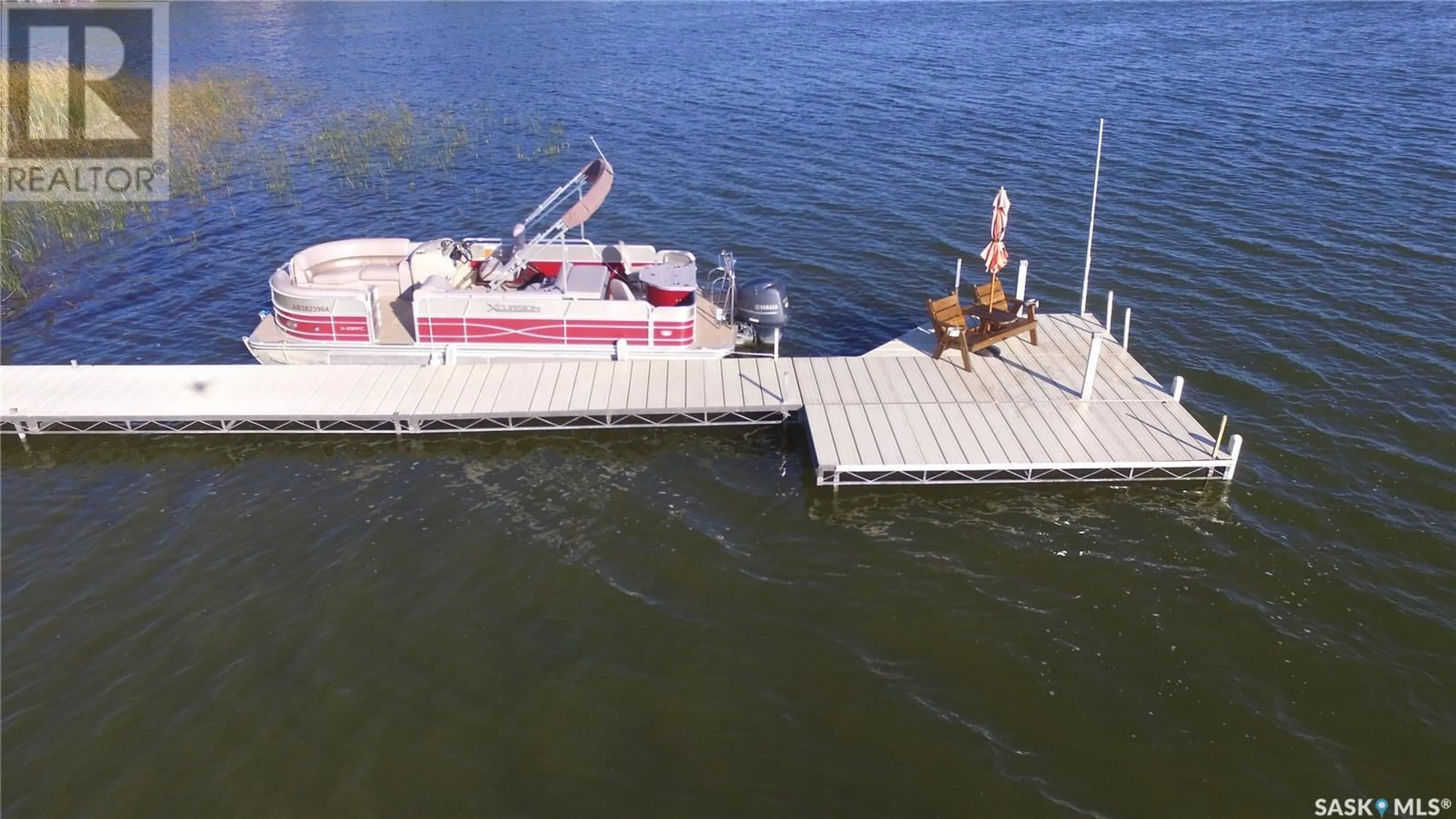 A pic from outside/outdoor area/front of a property/back of a property/a pic from drone, water/lake/river/ocean view for 105 JANICE PLACE, Emma Lake Saskatchewan S0J0N0