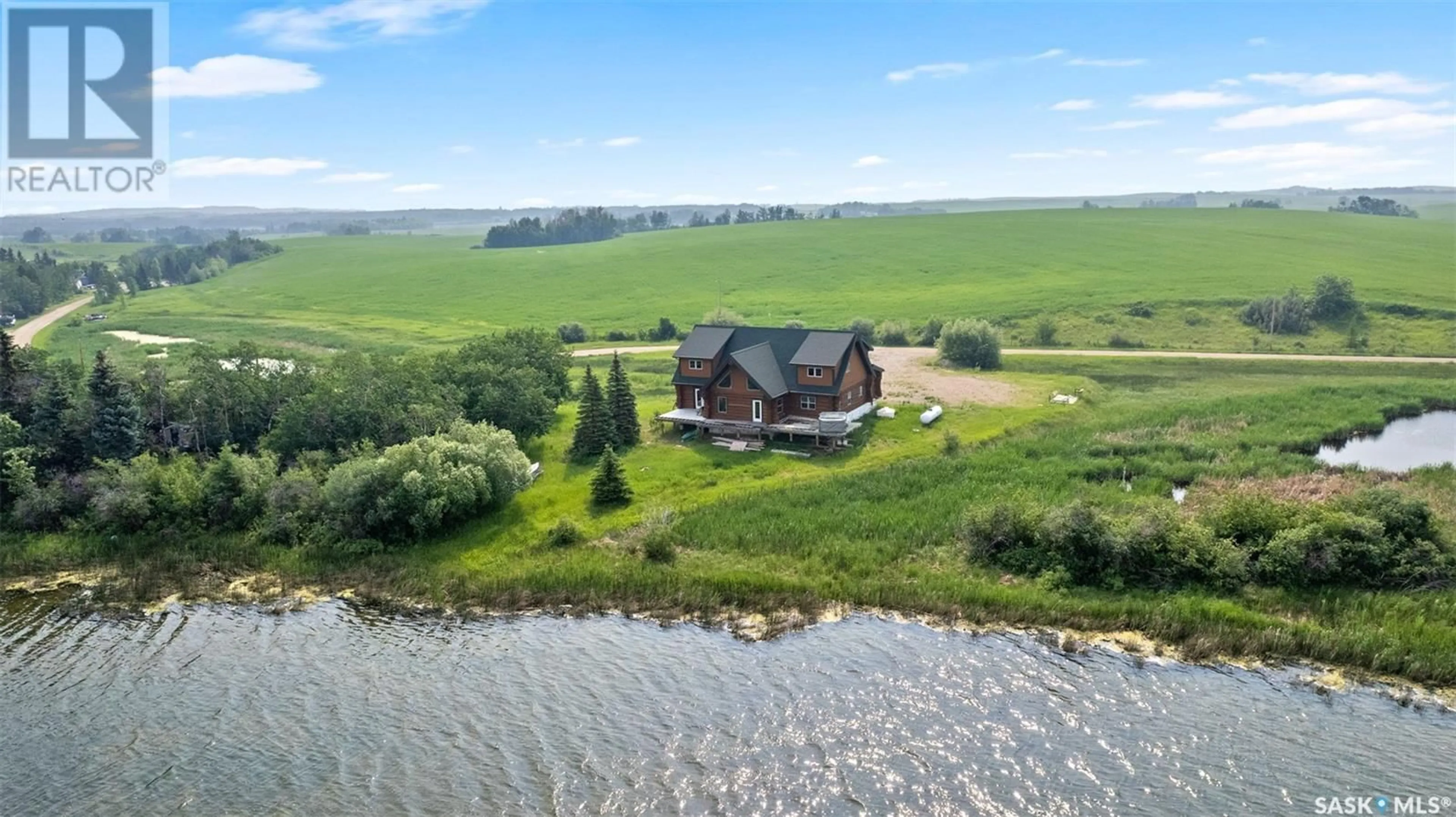 A pic from outside/outdoor area/front of a property/back of a property/a pic from drone, water/lake/river/ocean view for MARTIN'S LAKE SCENIC WATERFRONT LOG HOME, Leask Rm No. 464 Saskatchewan S0J1M0