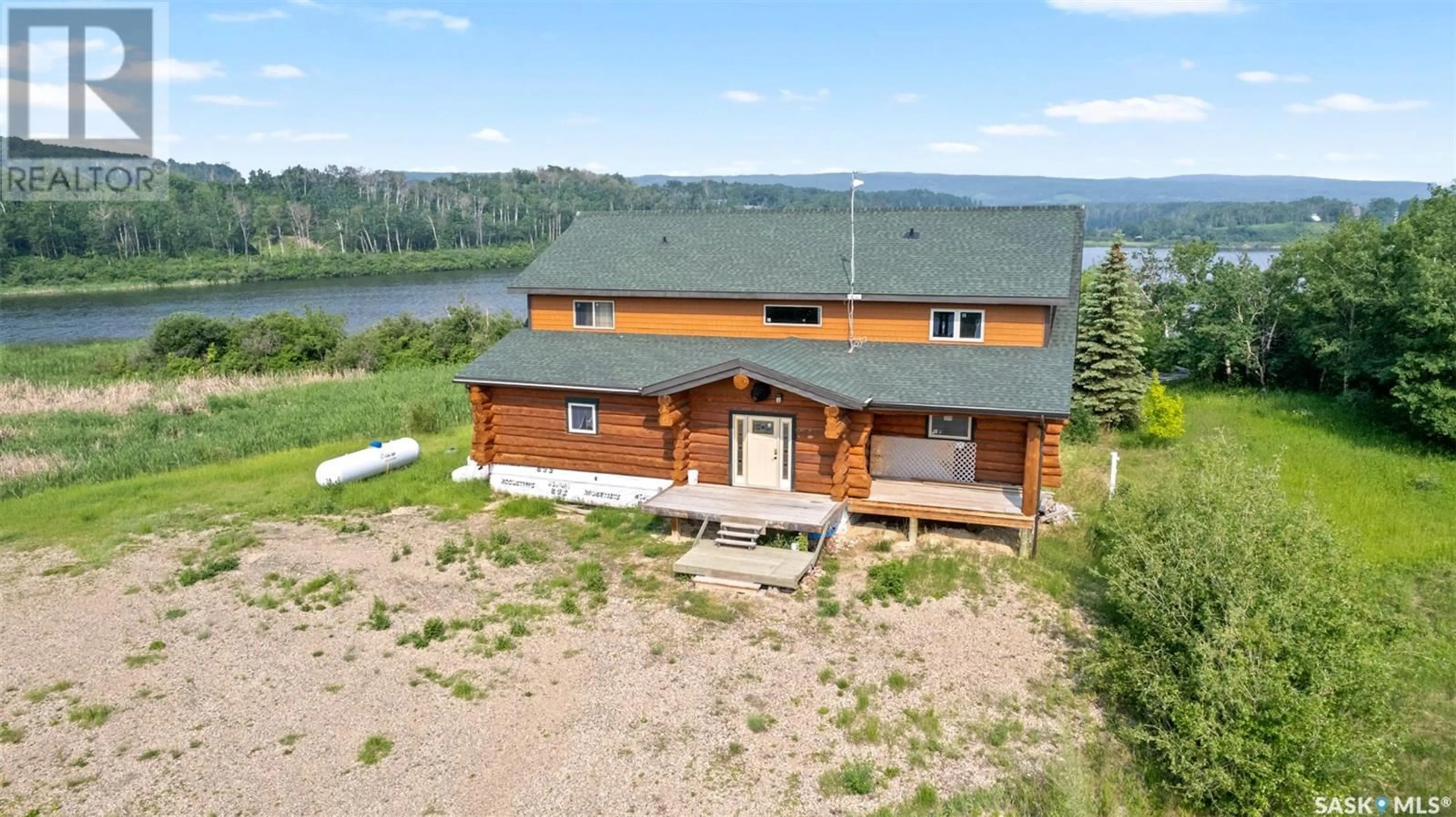 A pic from outside/outdoor area/front of a property/back of a property/a pic from drone, water/lake/river/ocean view for MARTIN'S LAKE SCENIC WATERFRONT LOG HOME, Leask Rm No. 464 Saskatchewan S0J1M0