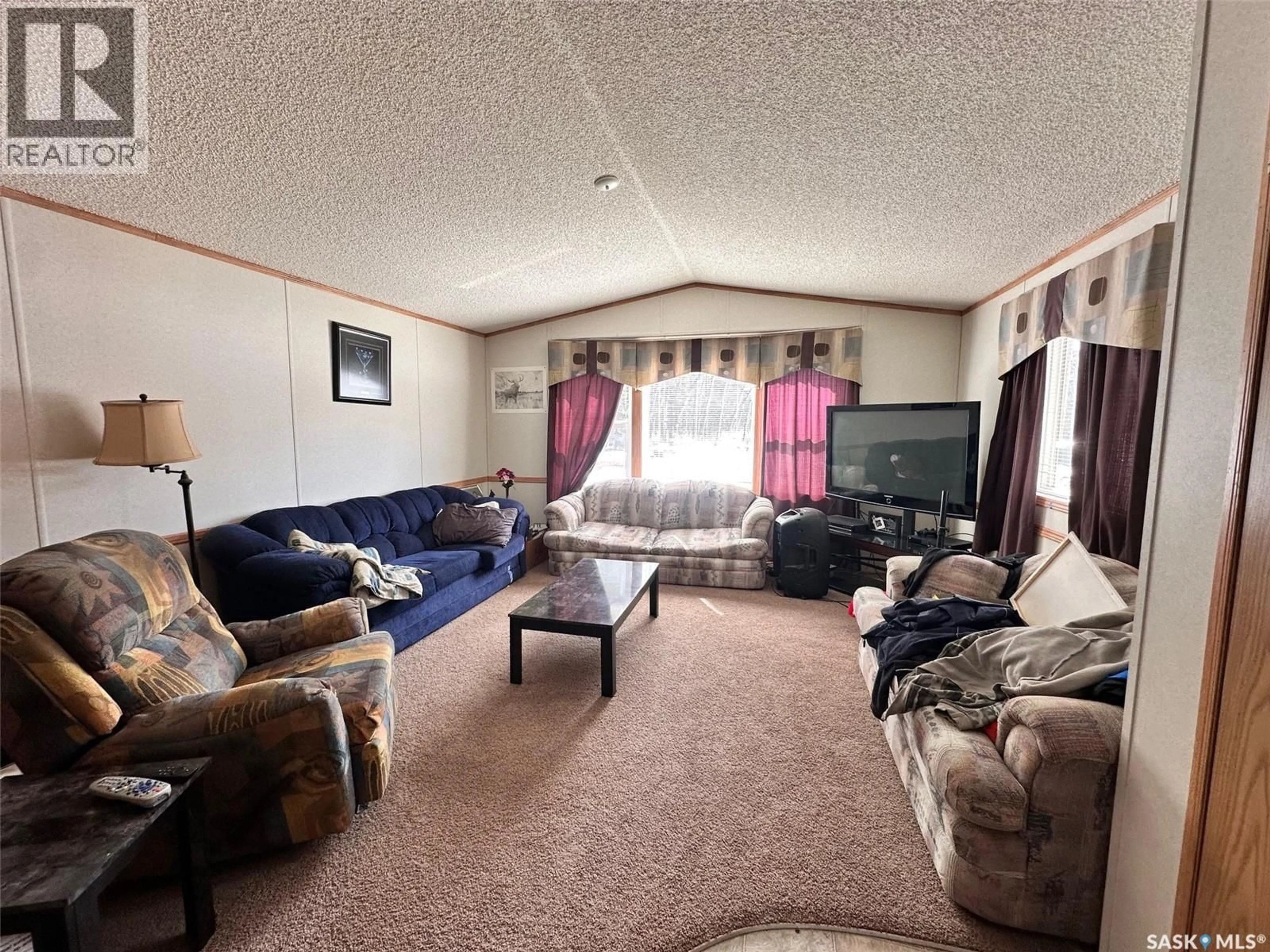 Living room with furniture, unknown for 103 5TH AVENUE, Chitek Lake Saskatchewan S0J0L0