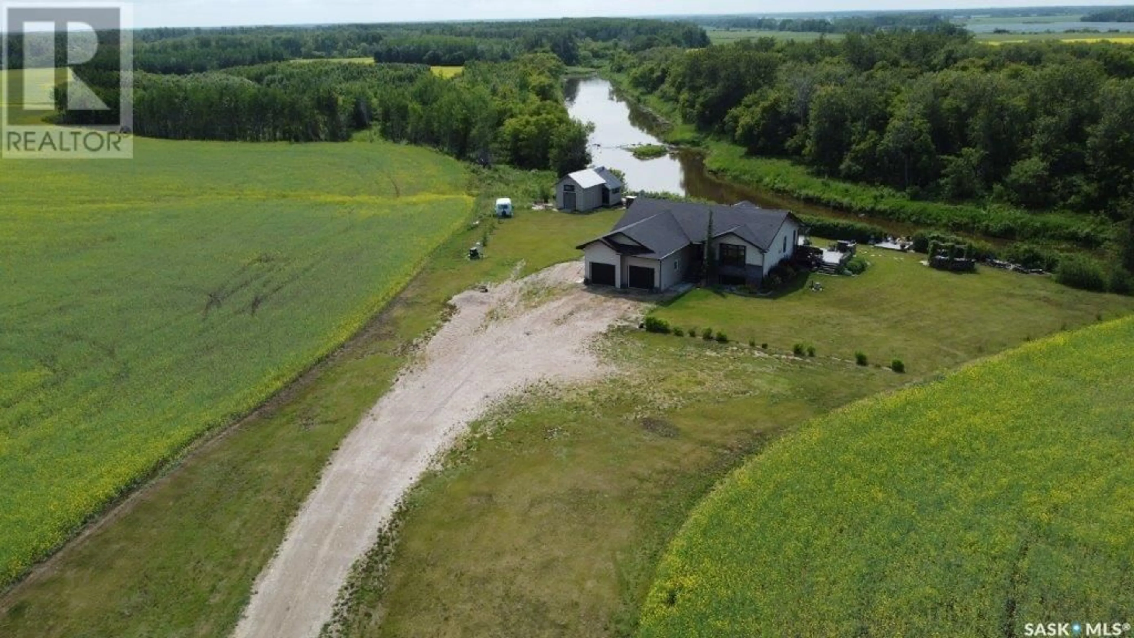 A pic from outside/outdoor area/front of a property/back of a property/a pic from drone, water/lake/river/ocean view for 15 ACRES ETOMAMI, Hudson Bay Rm No. 394 Saskatchewan S0E0Y0