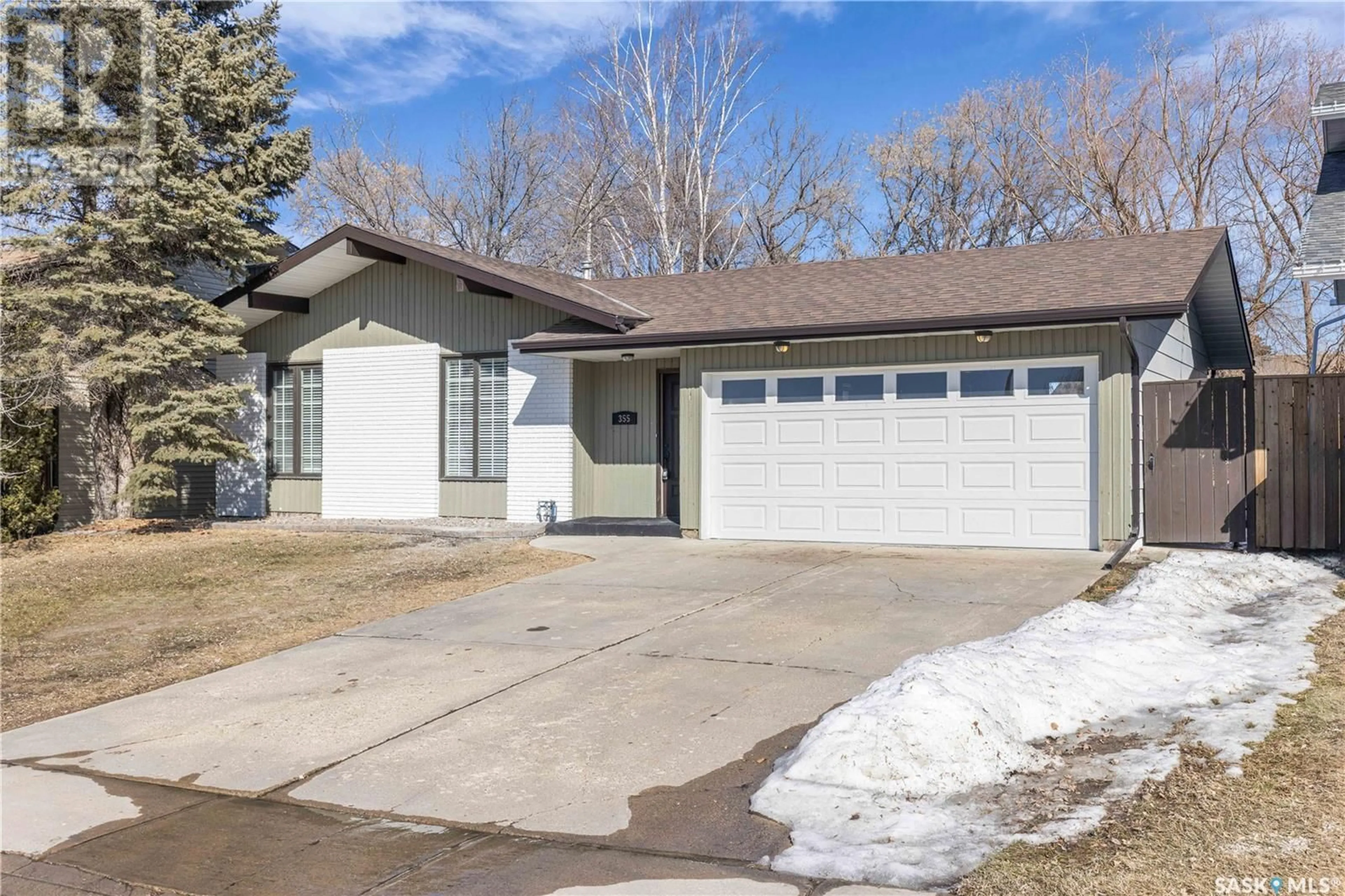 Home with vinyl exterior material, street for 355 THAIN CRESCENT, Saskatoon Saskatchewan S7K6N1