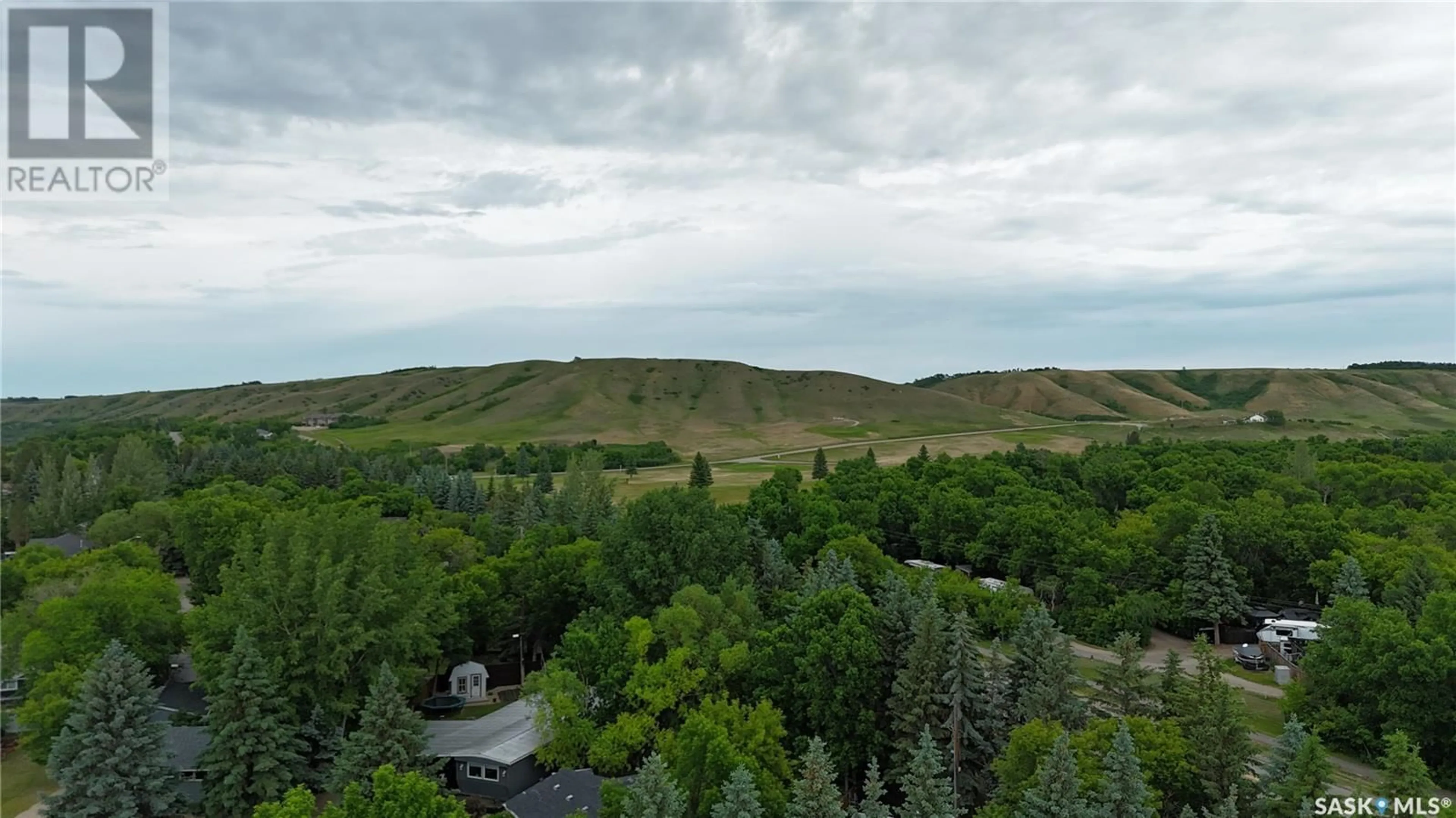 A pic from outside/outdoor area/front of a property/back of a property/a pic from drone, forest/trees view for 6 PINE STREET, Katepwa Beach Saskatchewan S0G2Y0