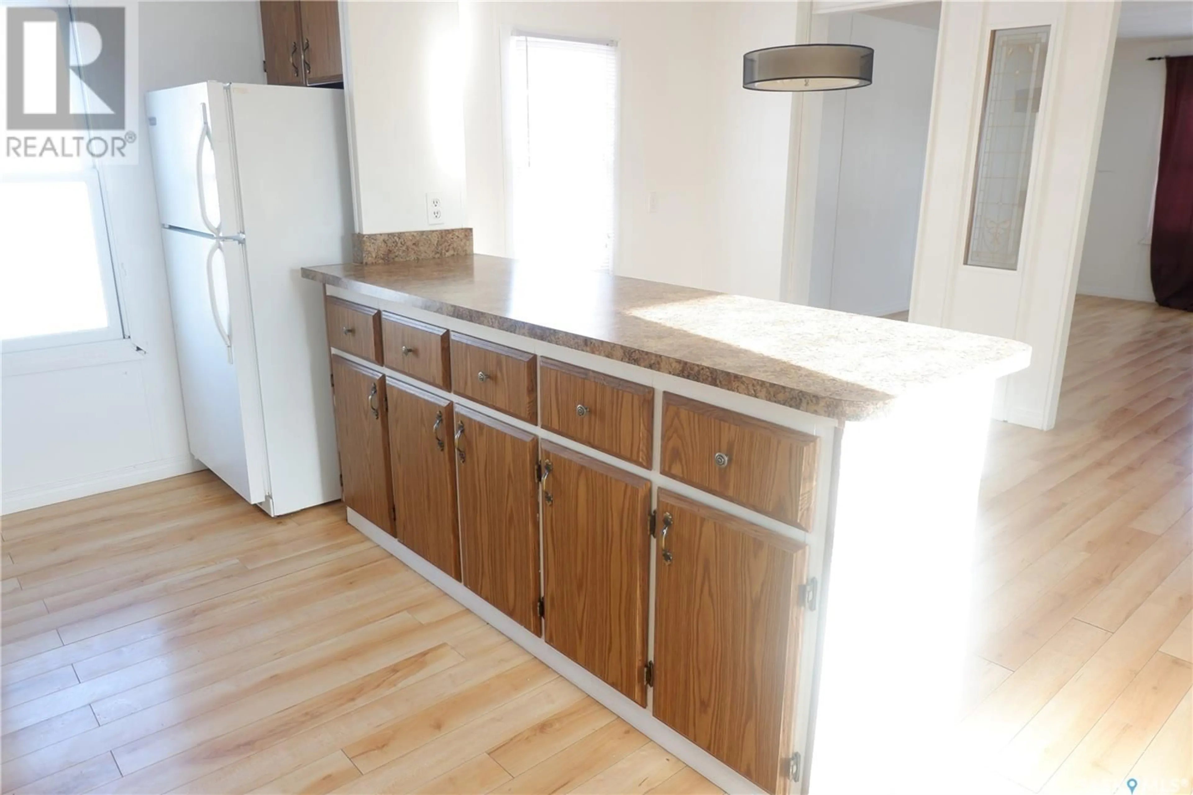 Standard kitchen, wood/laminate floor for 52 SUNRISE ESTATES, Assiniboia Saskatchewan S0H0B0