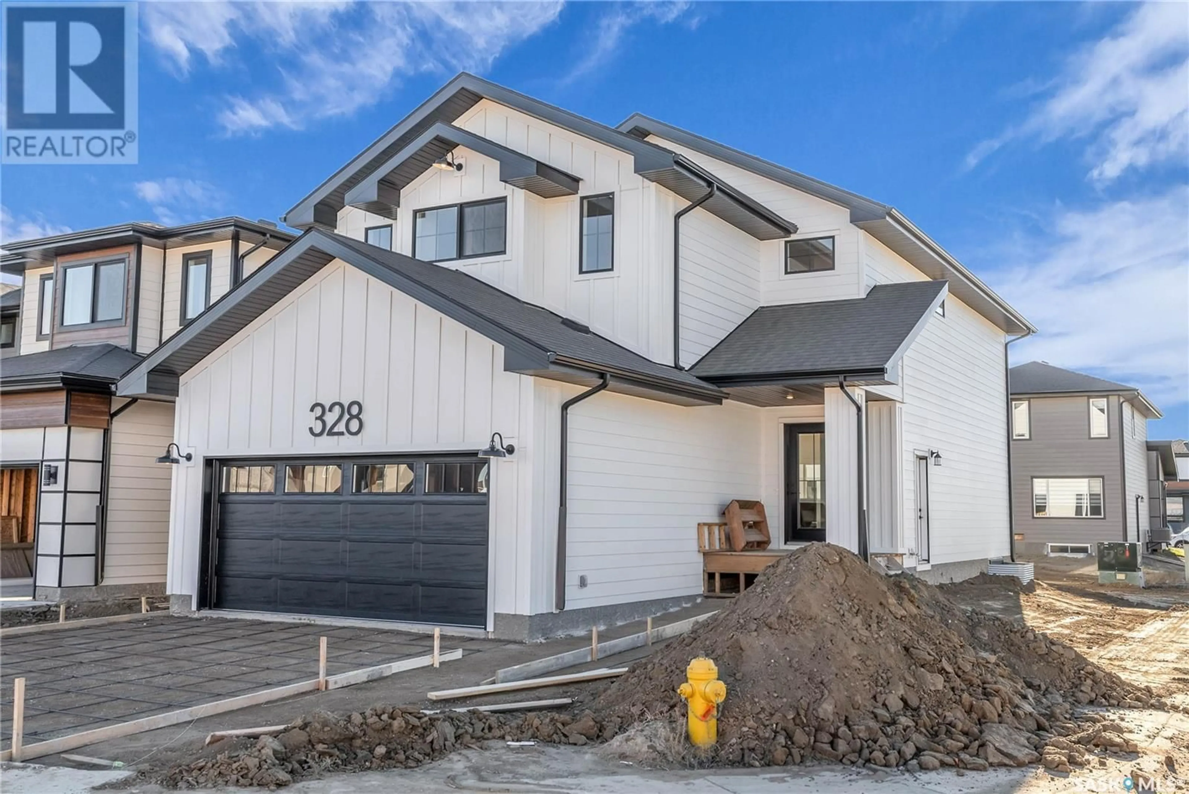 Home with vinyl exterior material, street for 328 LESKIW BEND, Saskatoon Saskatchewan S7V1R4