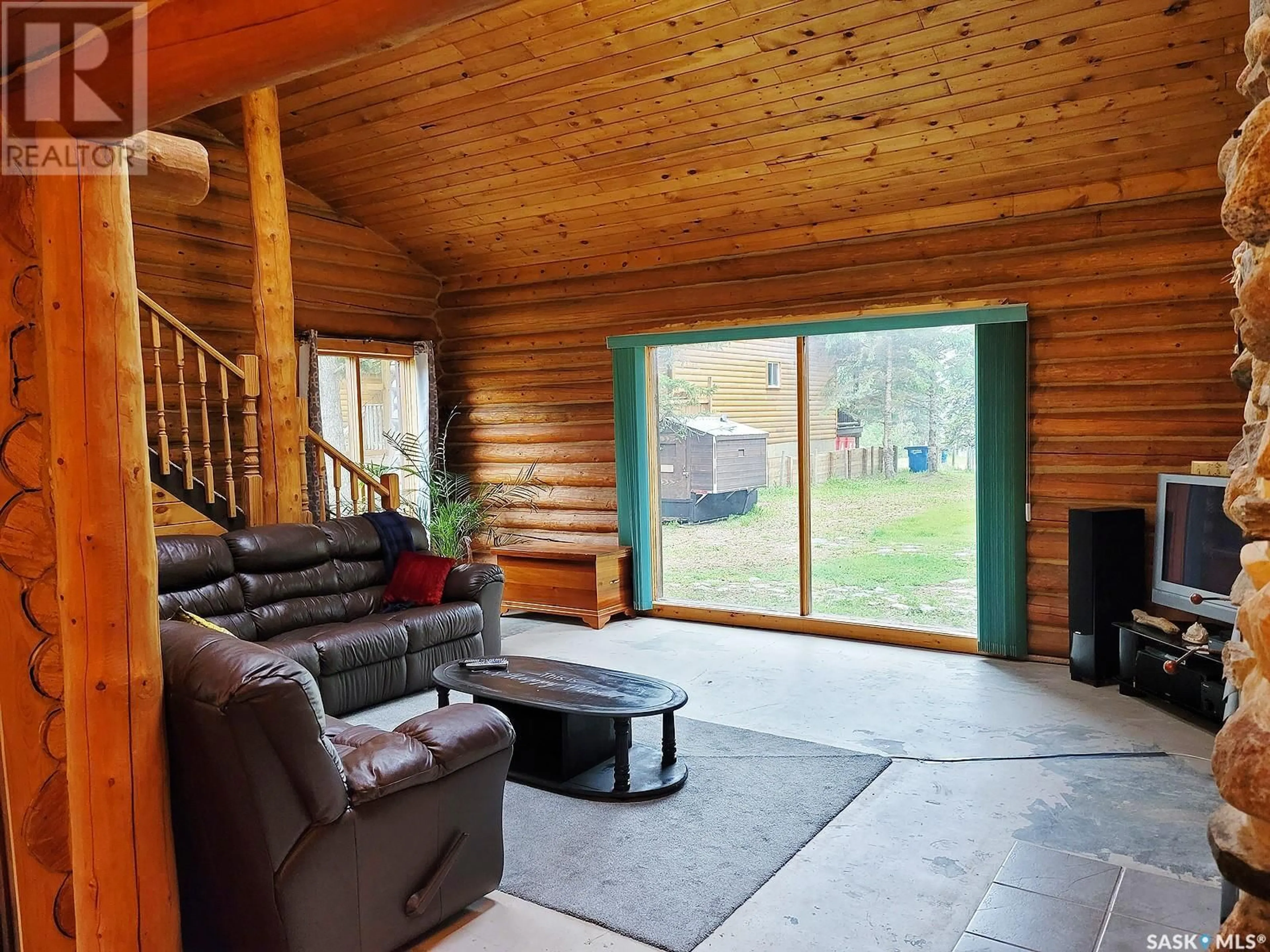 Living room with furniture, wood/laminate floor for 715 CHITEK DRIVE, Chitek Lake Saskatchewan S0J0L0