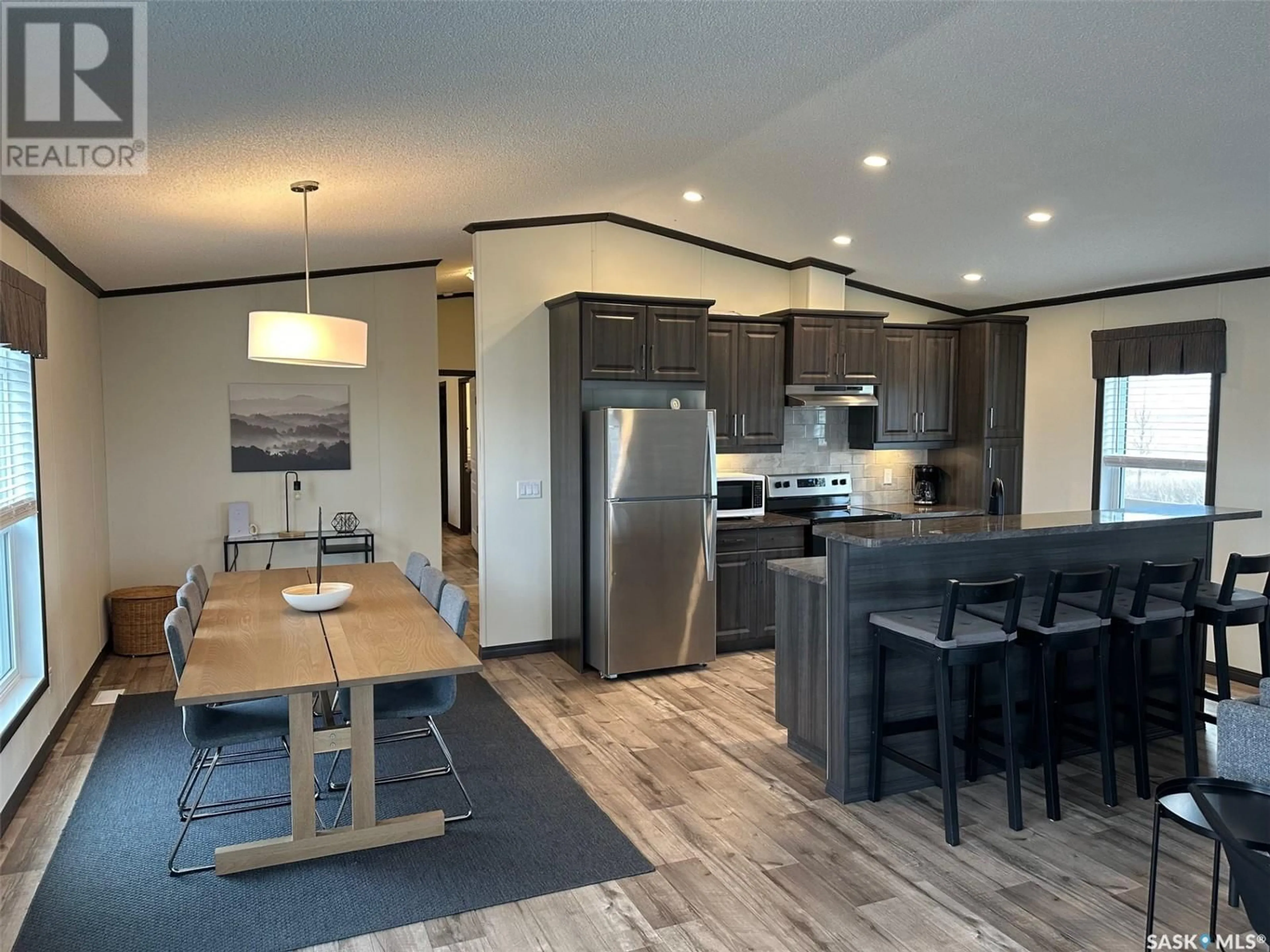 Open concept kitchen, wood/laminate floor for 9 LAKESHORE DRIVE, Gravelbourg Rm No. 104 Saskatchewan S0H1X0