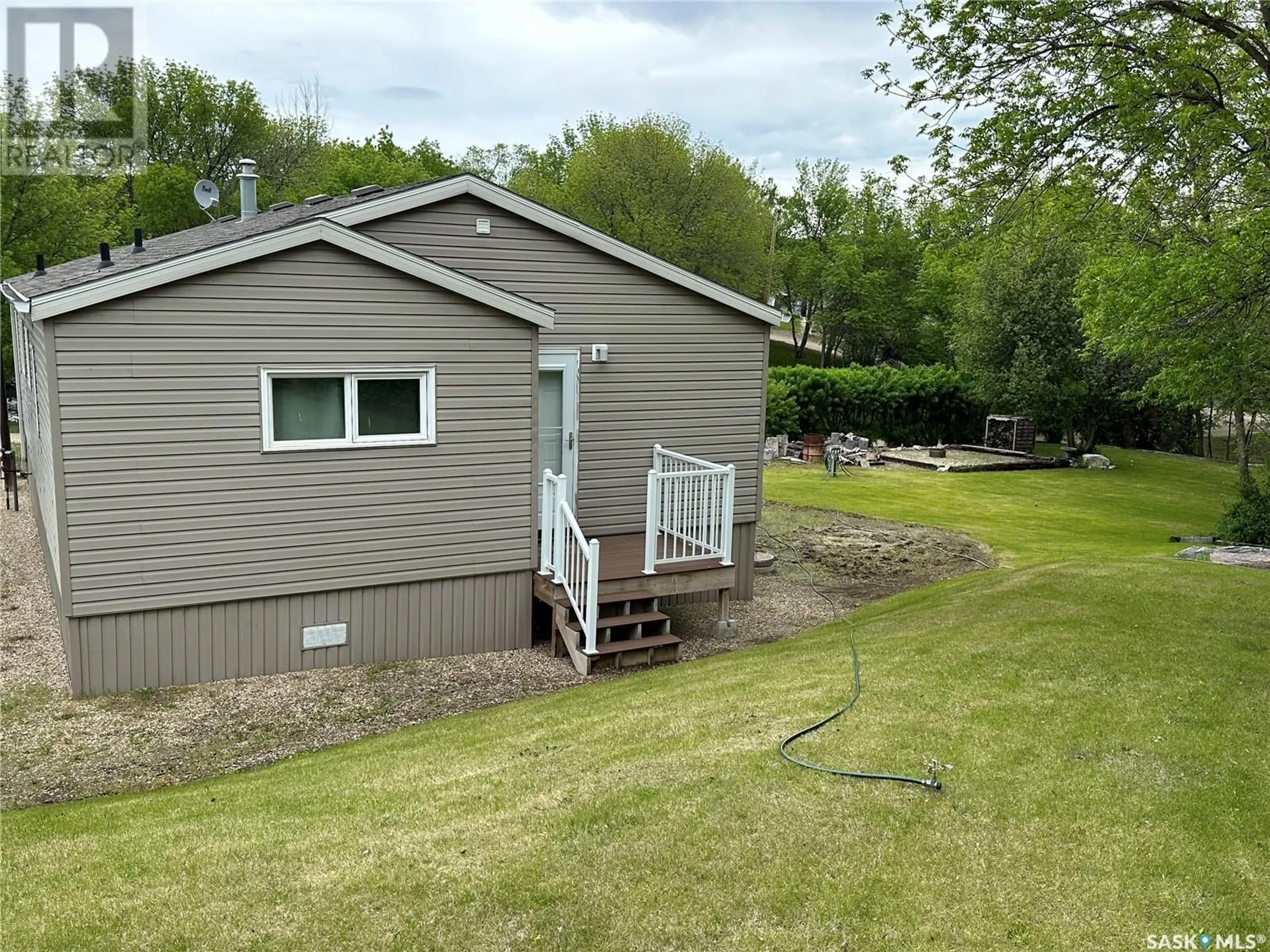 A pic from outside/outdoor area/front of a property/back of a property/a pic from drone, water/lake/river/ocean view for 101 DEER TRAIL, South Lake Saskatchewan S0H2X0