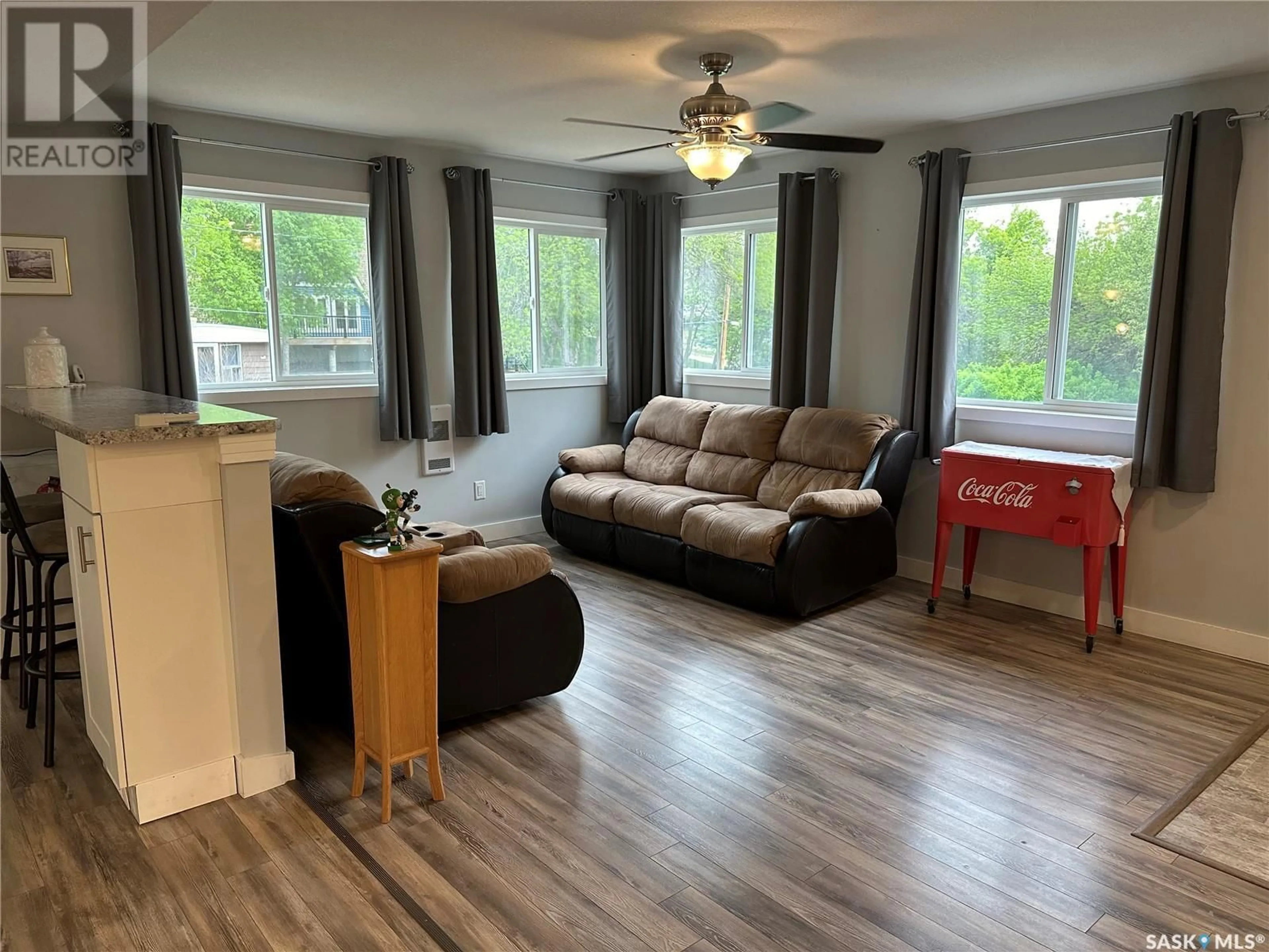 Living room with furniture, wood/laminate floor for 101 DEER TRAIL, South Lake Saskatchewan S0H2X0