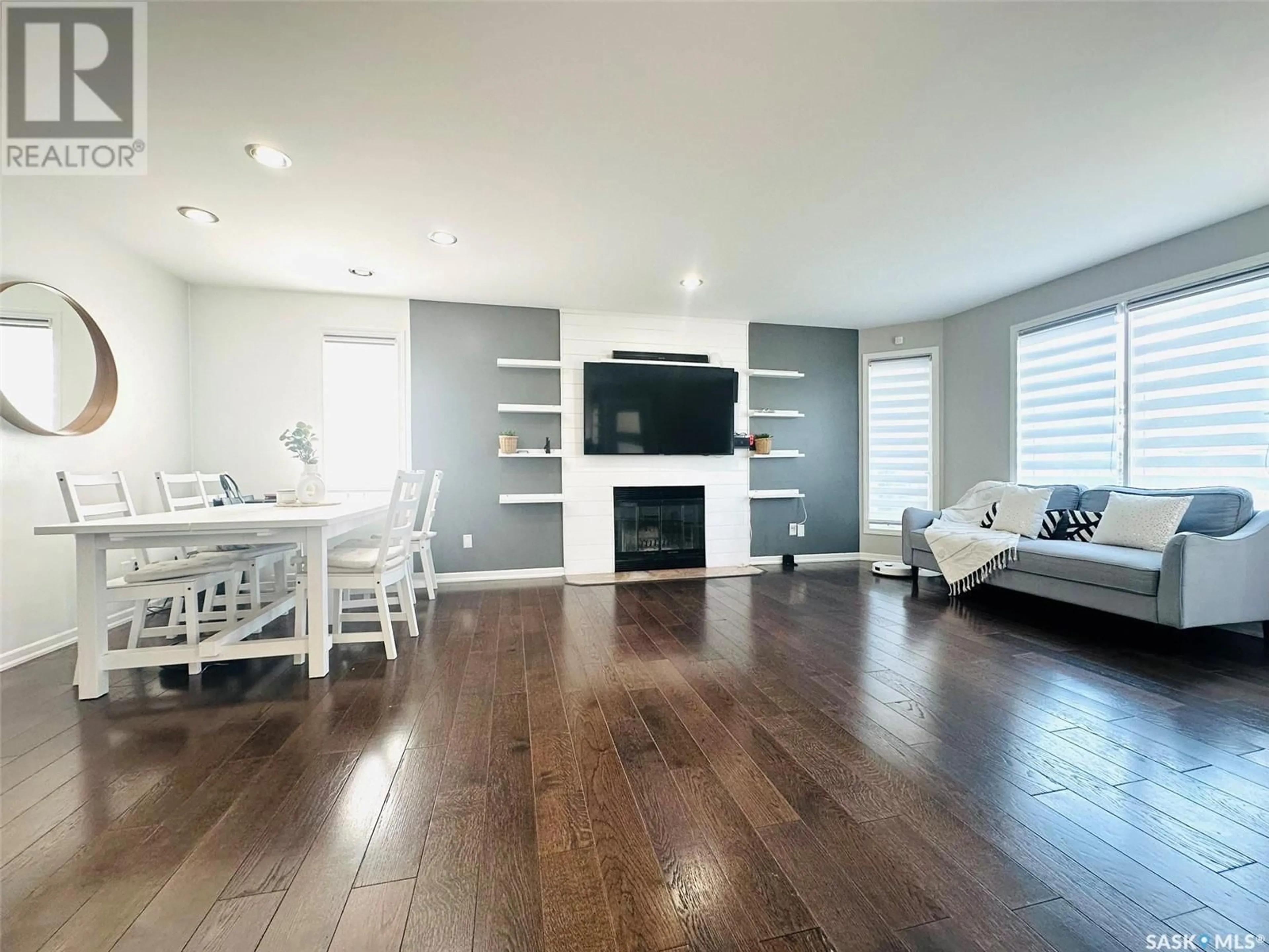 Living room with furniture, wood/laminate floor for 1484 MATHER CRESCENT, Estevan Saskatchewan S4A2J8