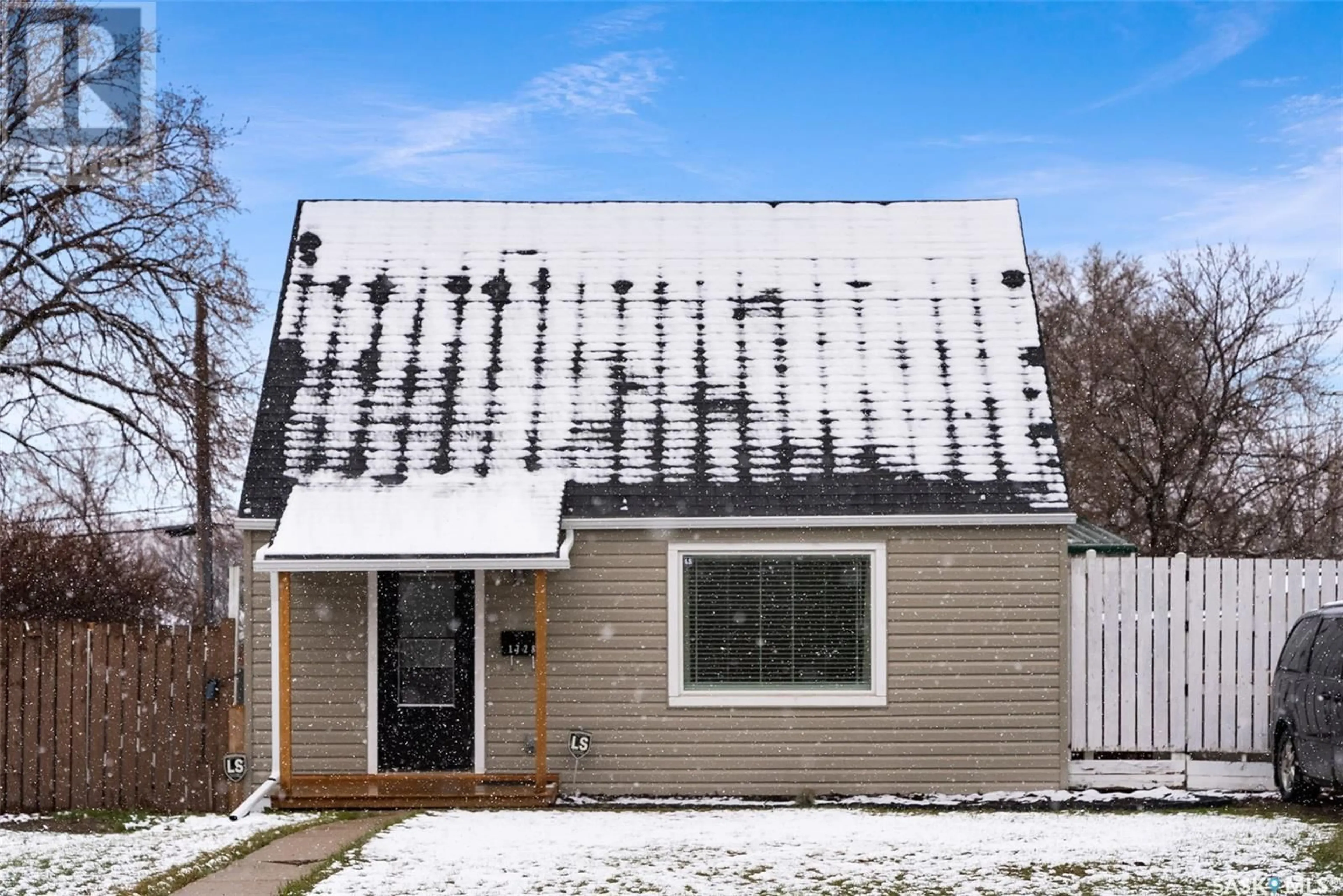 Home with vinyl exterior material, street for 1728 MCINTOSH STREET, Regina Saskatchewan S4T5C5
