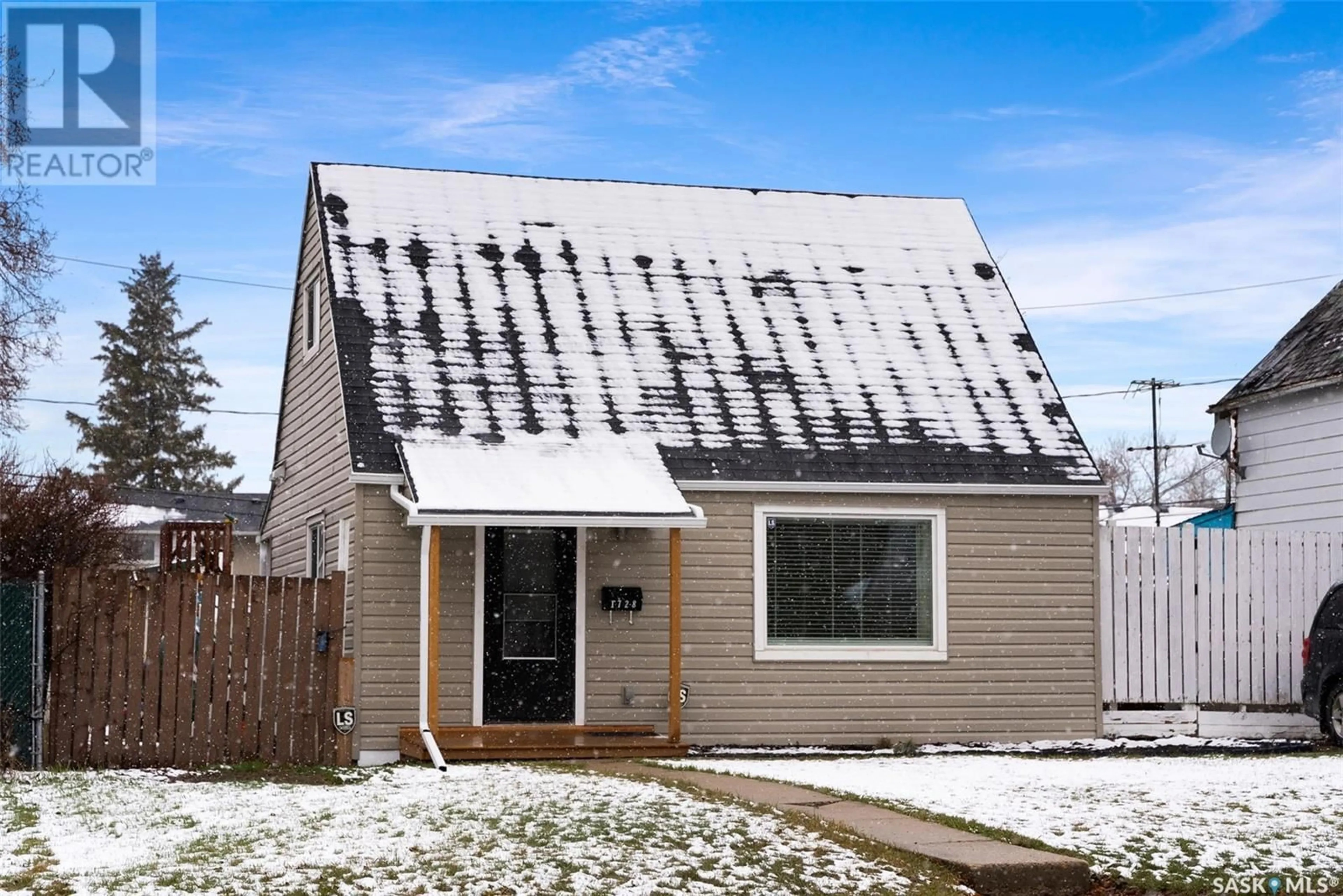 Home with vinyl exterior material, street for 1728 MCINTOSH STREET, Regina Saskatchewan S4T5C5
